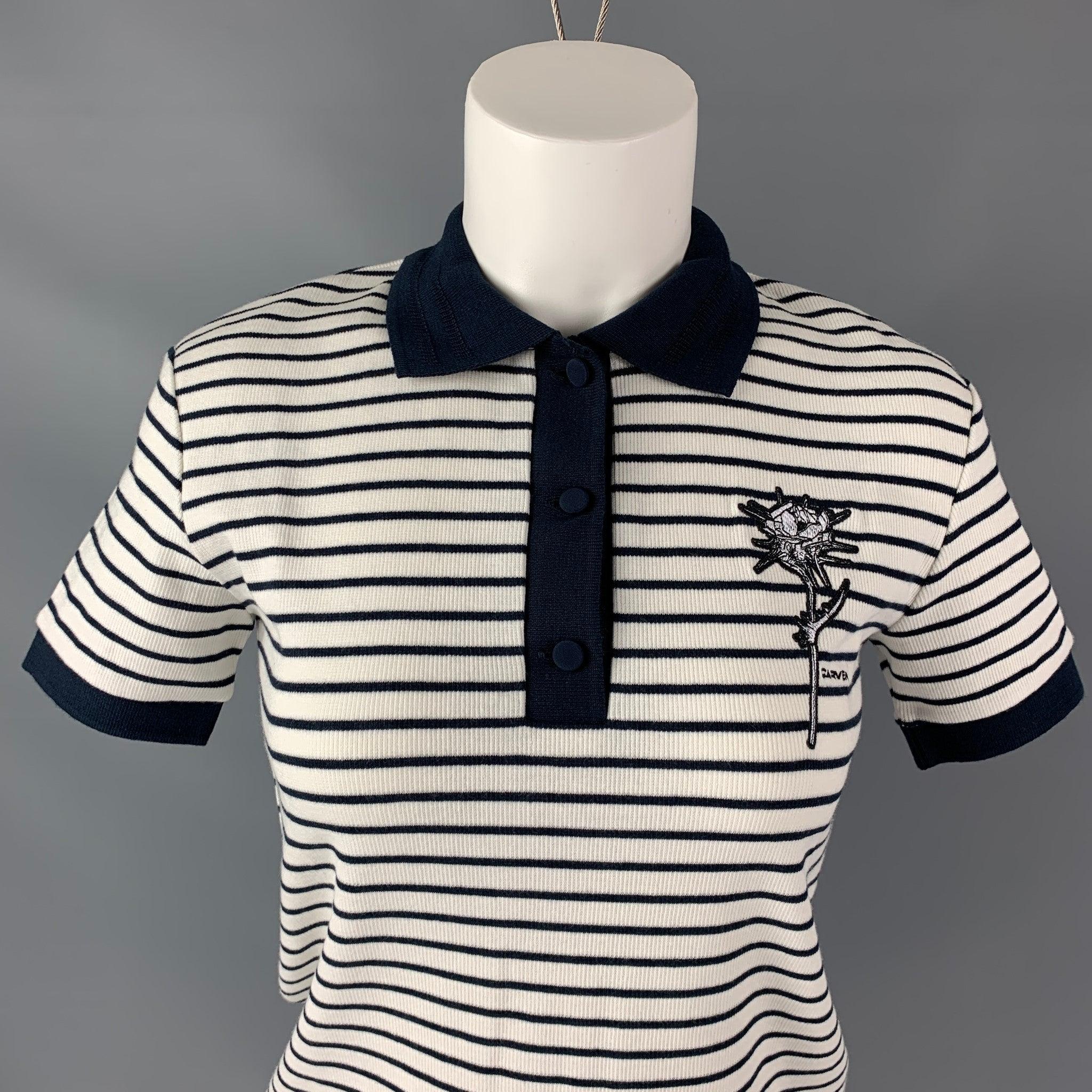 CARVEN polo shirt comes in white and navy cotton elastane fabric feature white and navy stripes and embroidered flower.Very Good Pre-Owned Condition. 
 

 Marked:  S 
 

 Measurements: 
  
 Shoulder:17 inBust: 33 inSleeve: 7 inLength: 21.5 in
  
  
