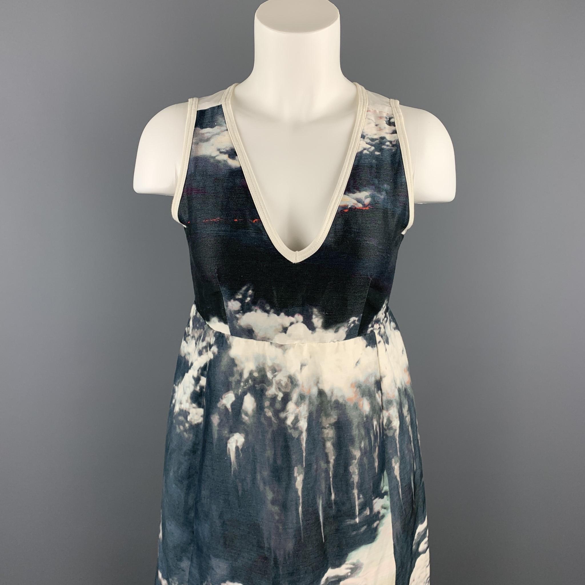 CARVEN cocktail dress comes in a whit linen / silk with a all over abstract print featuring a v-neck, front pockets, and a back zip up closure. 

Very Good Pre-Owned Condition.
Marked: 36

Measurements:

Shoulder: 11.5 in. 
Bust: 30 in. 
Waist: 28