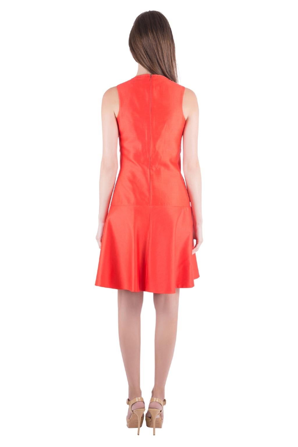 A creation so gorgeous to bring a smile on your face. This Carven sleeveless dress comes in orange color. Tailored from cotton and silk, this drop waist dress provides a great fit. It features two external pockets and a zip closure.

Includes: The