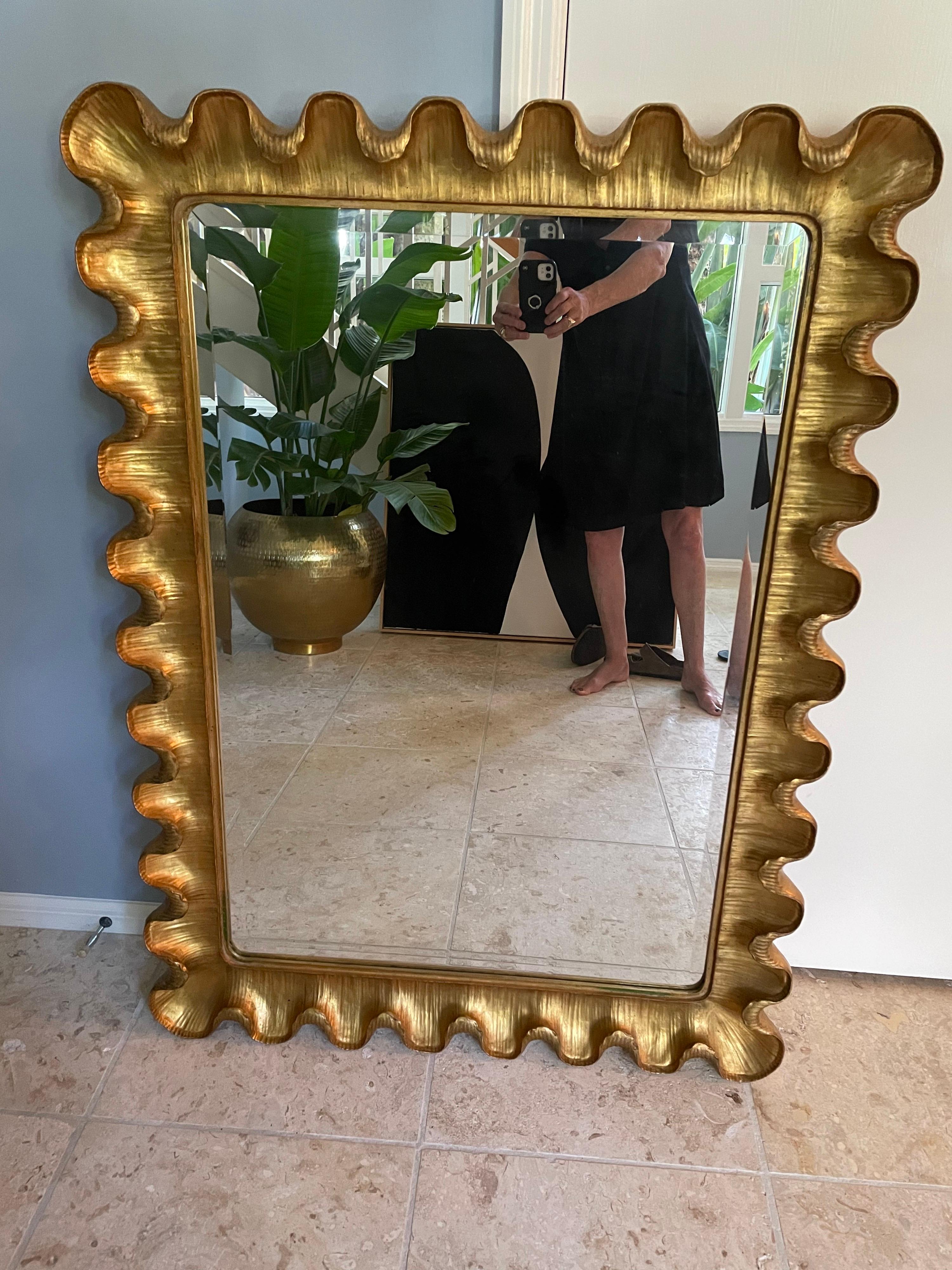 This is a wonderful mirror by Carvers Guild and is called the wave moderne in gold . It is a beautiful wall mirror that would look lovely in any home A beveled mirror adds extra cachet. Carvers Guild mirrors have been made in usa since 1970s.