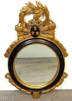Miroir mural ovale en bois doré et ébénisé, de style Louis XVI, de la Carvers' Guild, vers 1965