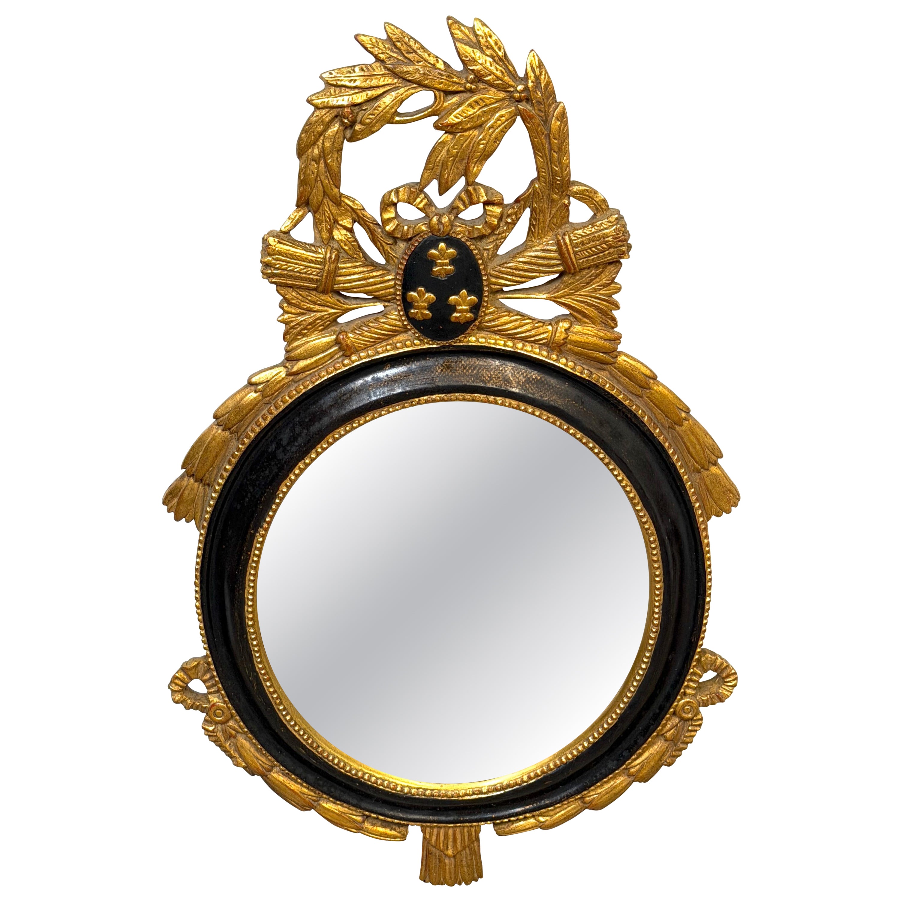 Miroir mural ovale en bois doré et ébénisé, de style Louis XVI, de la Carvers' Guild, vers 1965