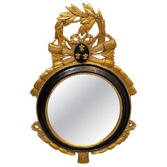 Miroir mural ovale en bois doré et ébénisé, de style Louis XVI, de la Carvers' Guild, vers 1965