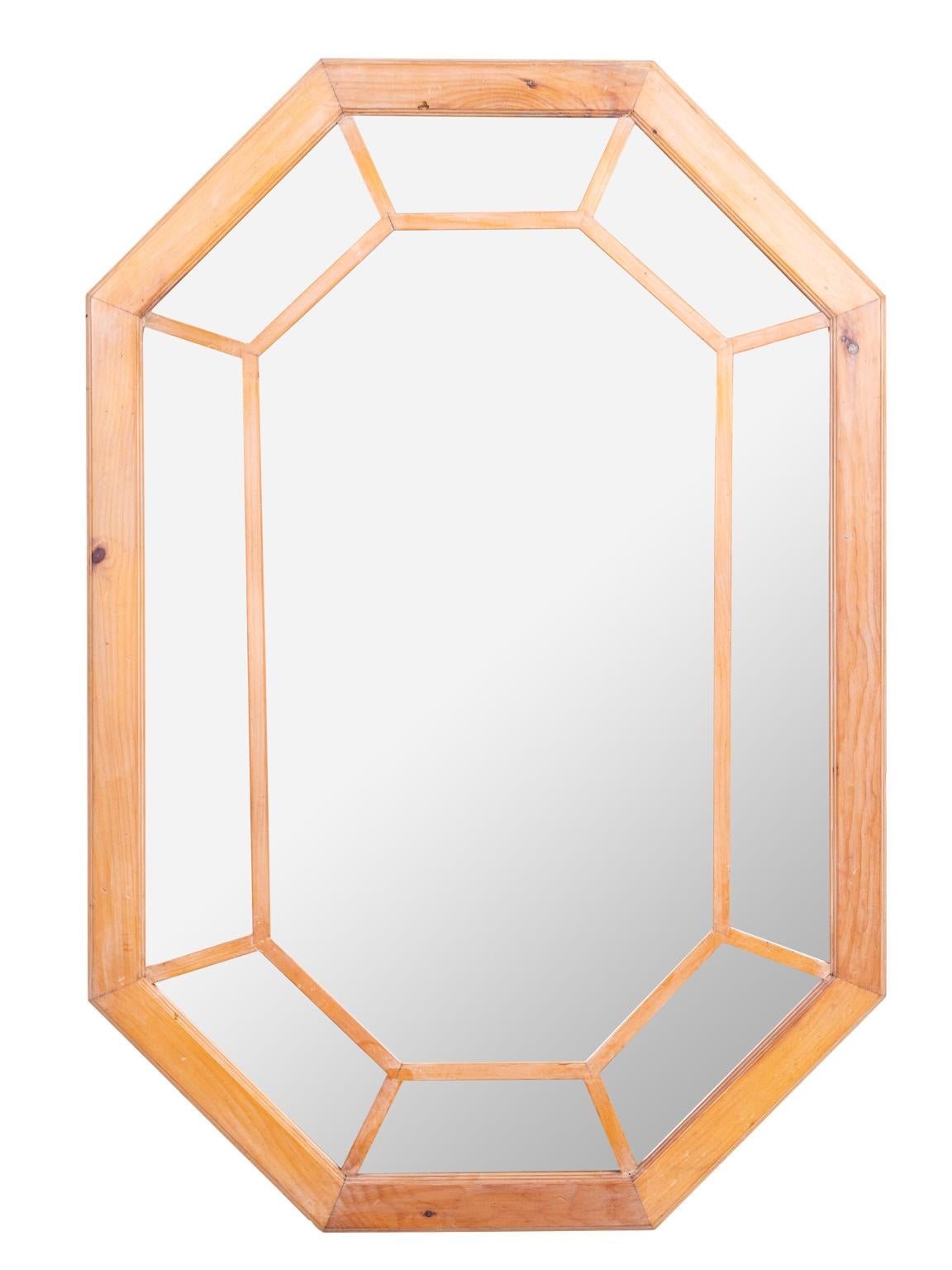 Carvers guild stripped pine octagon shape mirror. Has a nice vintage look of English scrubbed pine, with wax finish. Makers label on back. Made in USA.
