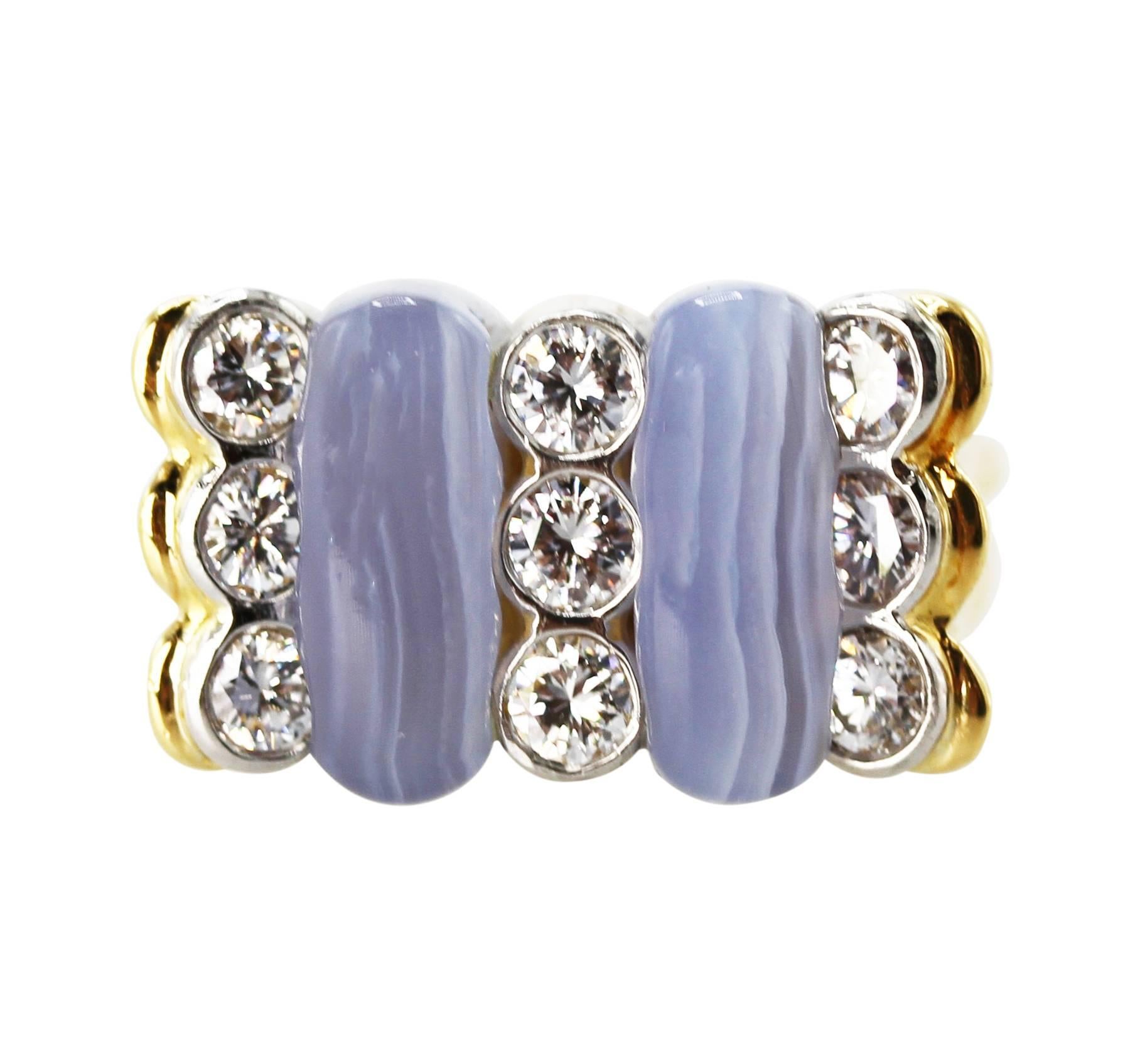 18 Karat Yellow Gold, Blue Agate and Diamond Ring by Carvin French
• Marked 750 with makers mark for Carvin French 
• 9 round diamonds approximately 1.35 carats 
• Size 5 3/4, gross weight 13.7 grams