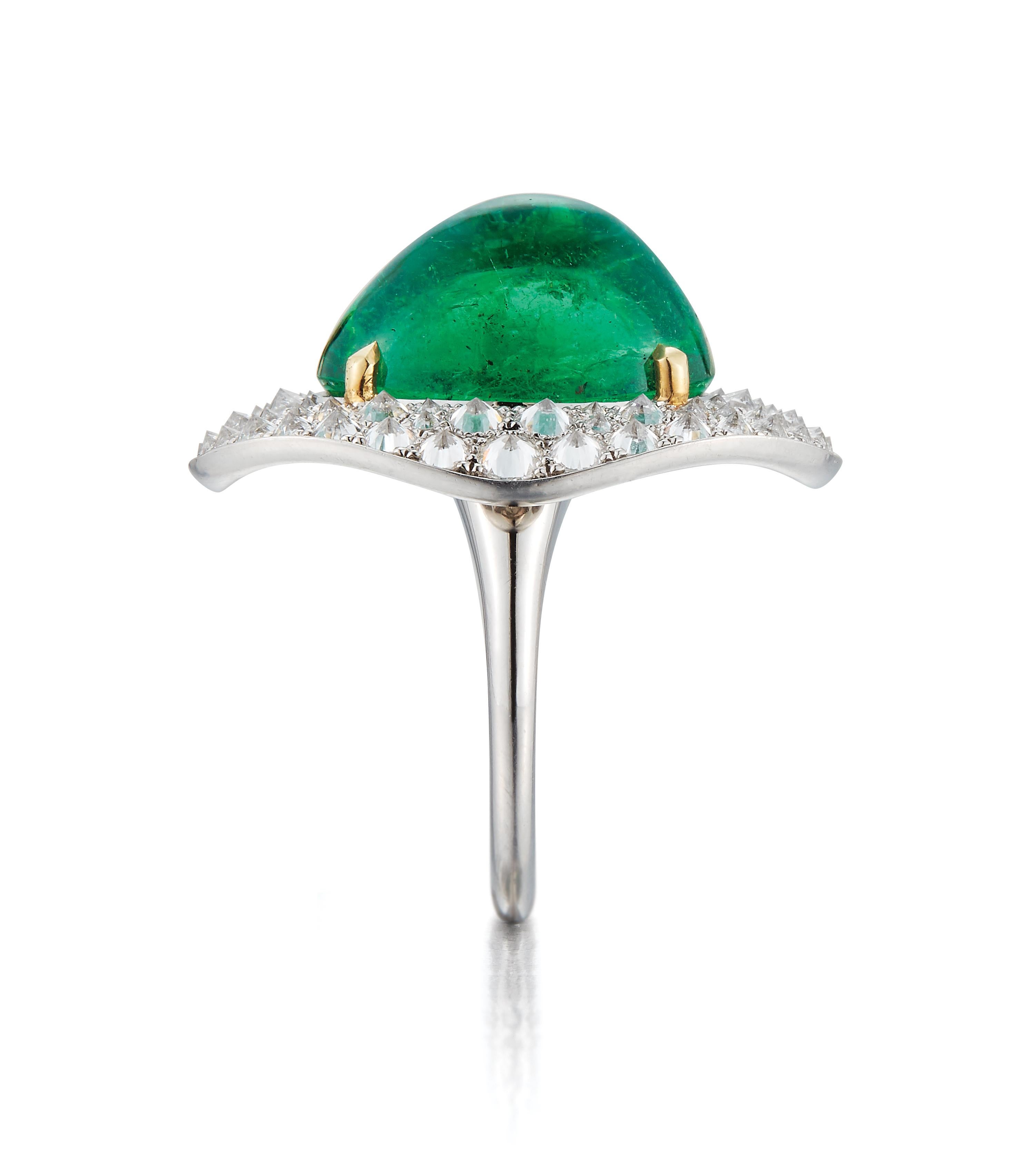  Carvin French Cabochon Emerald and Diamond Ring

A refined and elegant ring by Carvin French, featuring a mesmerizing cabochon-cut emerald weighing approximately 3.50 carats set within a diamond pavé frame. The ring is crafted in platinum, with the