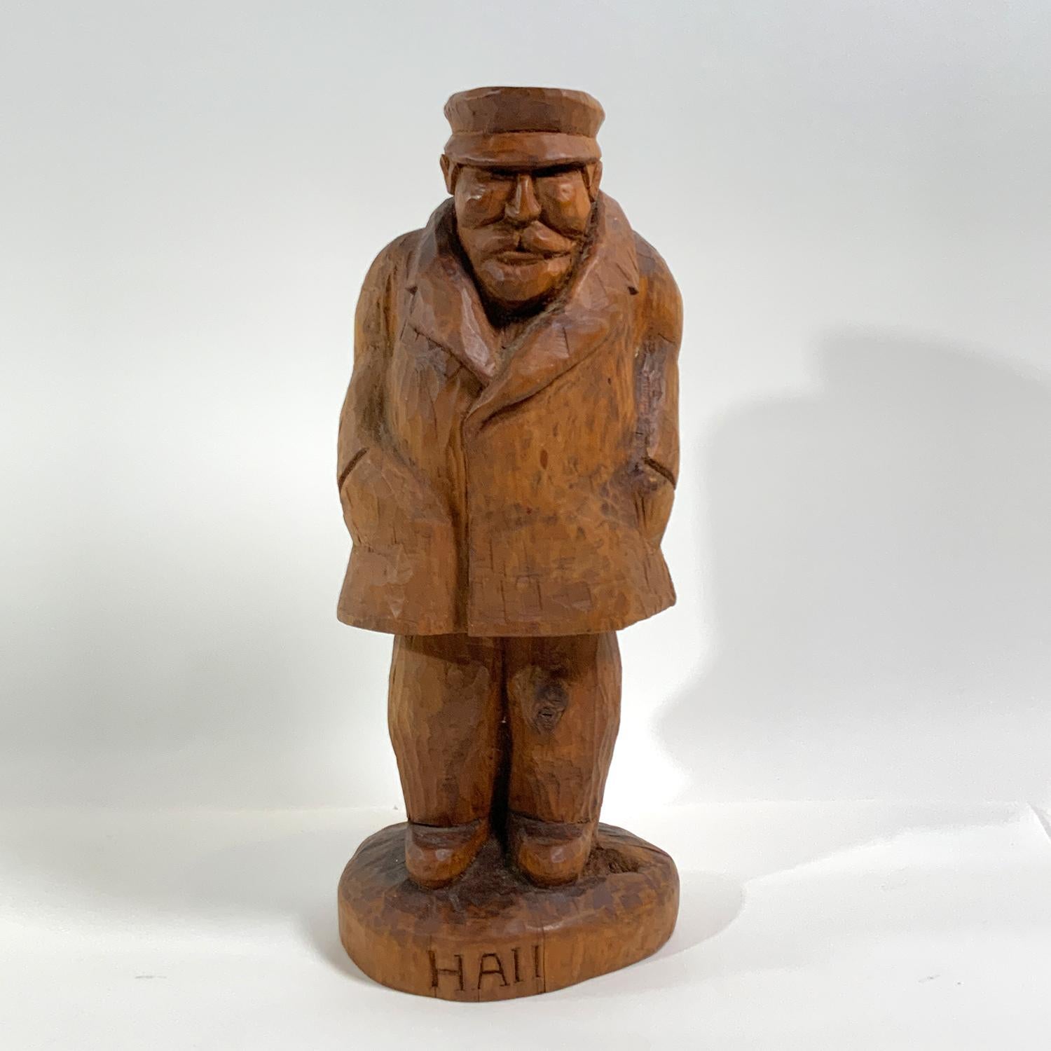 Folk art carving of a Sea Captain in his deck coat and cap. Historic old carving. What a great maritime relic. Circa 1930.