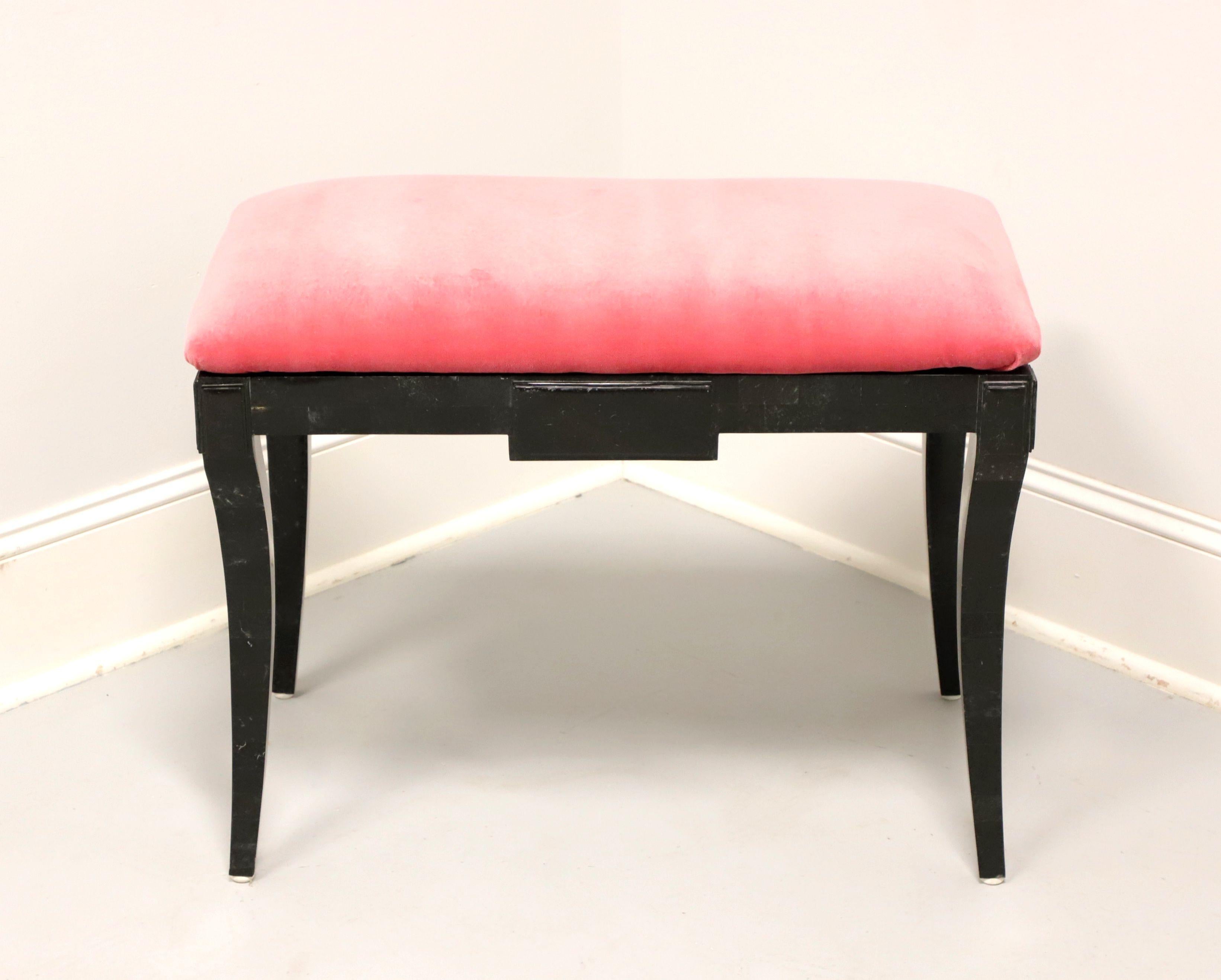 A Neoclassical style vanity bench by Casa Bique, of Thomasville, North Carolina, USA. Solid wood frame with tessellated green/black marble veneers, pink velvet like fabric upholstered seat, neoclassical elements to the apron, and flared legs. Made