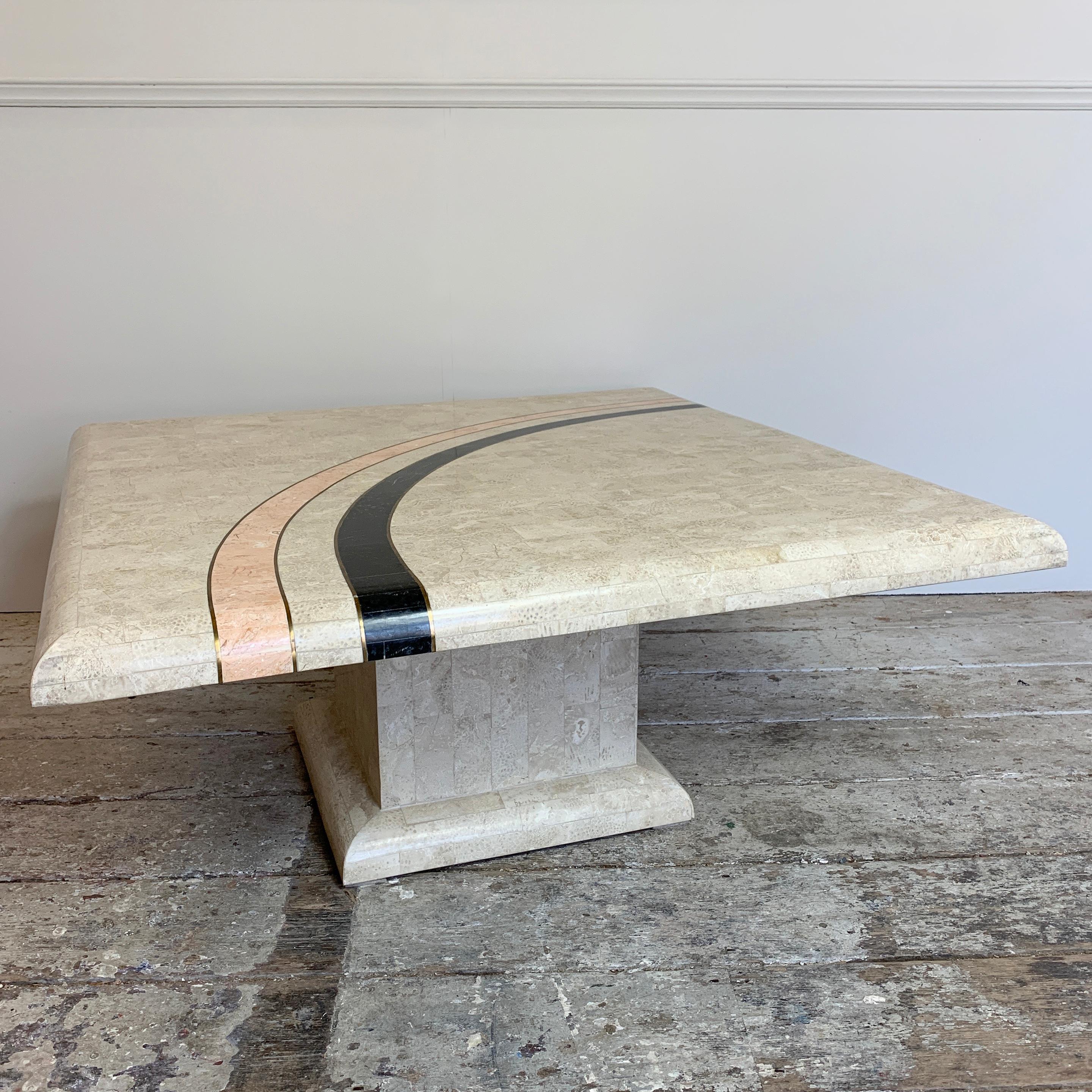 Casa Bique coffee table
1980s
Attributed to designer Robert Marcius for Casa Bique
Square table in tessellated marble with single central leg
Featuring an abstract curve design in black and soft pink, accented with brass inlay
Constructed of