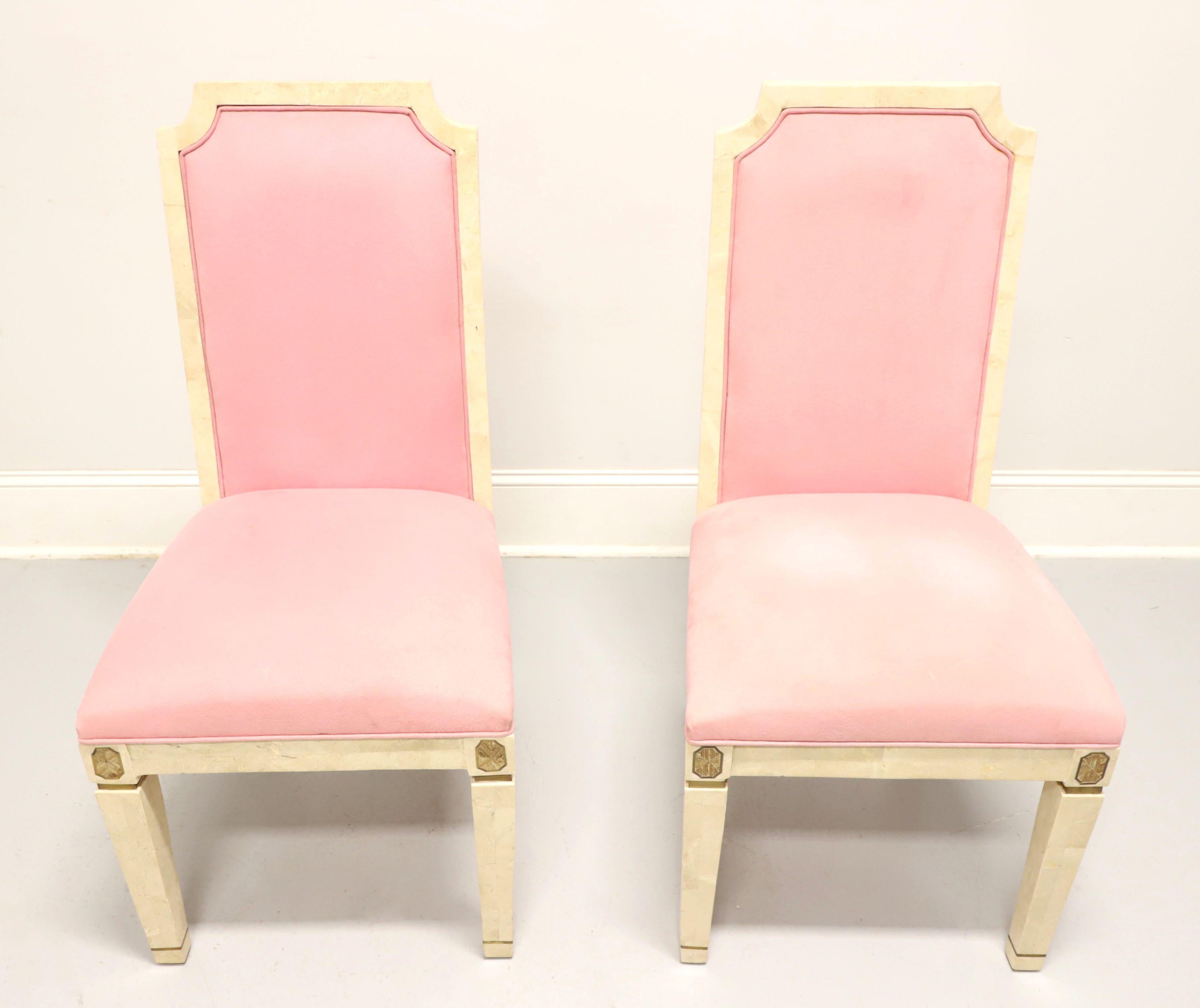 A pair of neoclassical style side chairs by Casa Bique, of Thomasville, North Carolina, USA. Solid wood frame with tessellated white marble veneers, high backs, pink velvet like fabric upholstered backs & seats, gold emblem trim to each side of