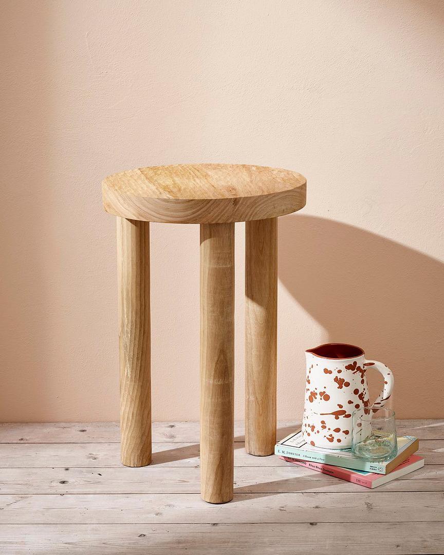 This Casa Cubista Carved Wood Stool is the perfect addition to any home. Crafted from natural, Fair Trade wood and carved with a Minimalist and organic modern design, it can be used as a stool, side table, or home decor. It adds a rustic yet