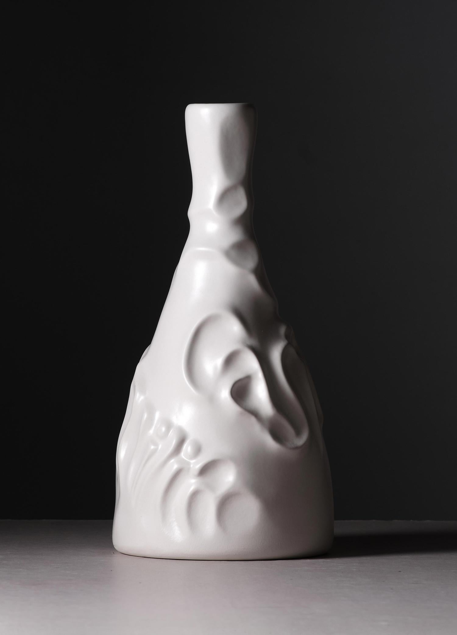 Casa de Familia Ceramic Bottle by Josep Maria Jujol
Dimensions: Ø 14 x H 28 cm.
Materials: Ceramic.

Over a century ago this sculptural bottle was designed in glass. Now, a new, weightier version is reimagined in ceramic.

A new and improved