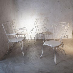 Lio Carminati set of four chairs iron 1950s
