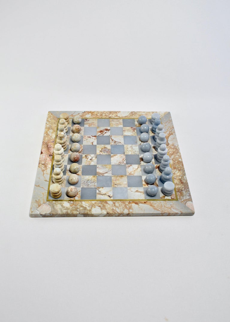 The Chess Set by Casa Shop, the second design in our stone collection handmade by artisans in Perú. 

Each set features hand-carved pieces and a board in Soapstone and Soft Blue Celestine. The board is accented in brass inlay and comes packaged in
