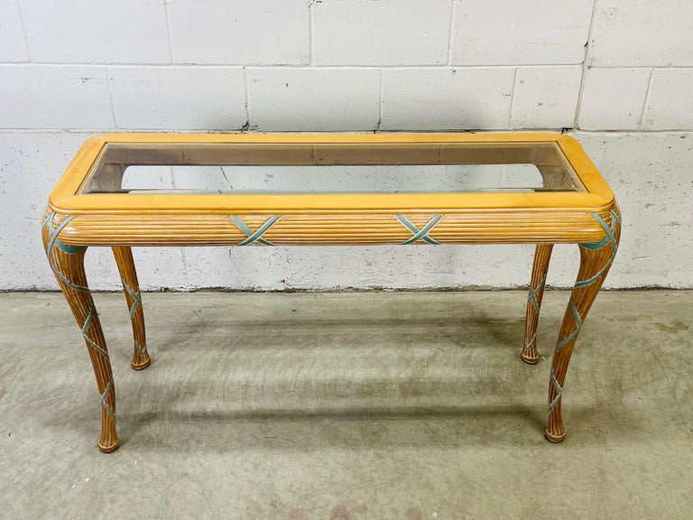 Vintage 1980s Italian hand carved rectangular glass top console table by Casa Stradivari of New York. The table is carved with banded sheaths of wheat in a maple wood. The glass top is beveled and the table has cabriole style legs. No marks.