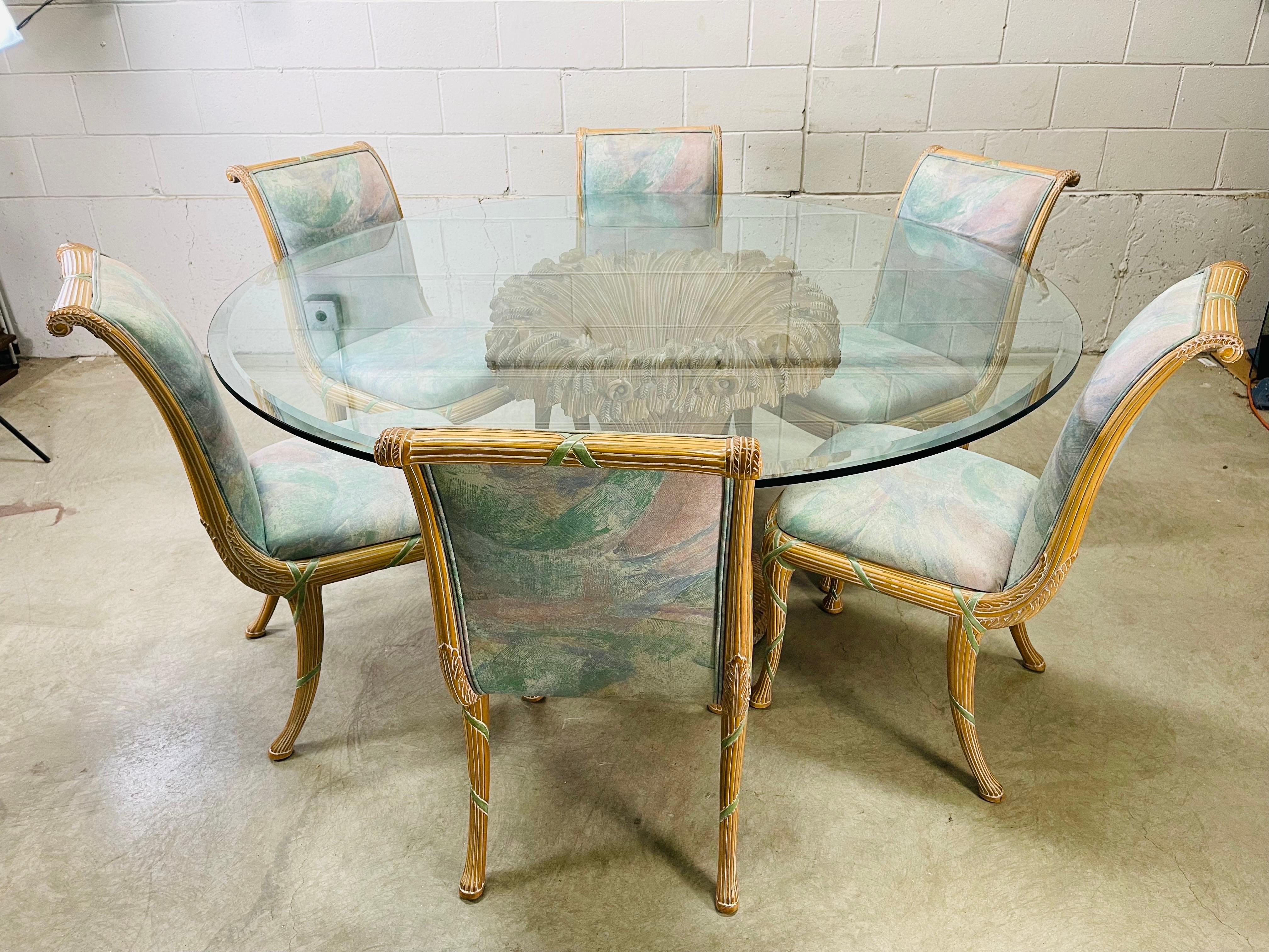 Vintage 1980s Italian hand carved round dining set by Casa Stradivari of New York. The set is carved in a Banded Sheaths of Wheat design. The glass top table is a beveled .5” thick piece of glass. The chairs have the original fabric and all are in