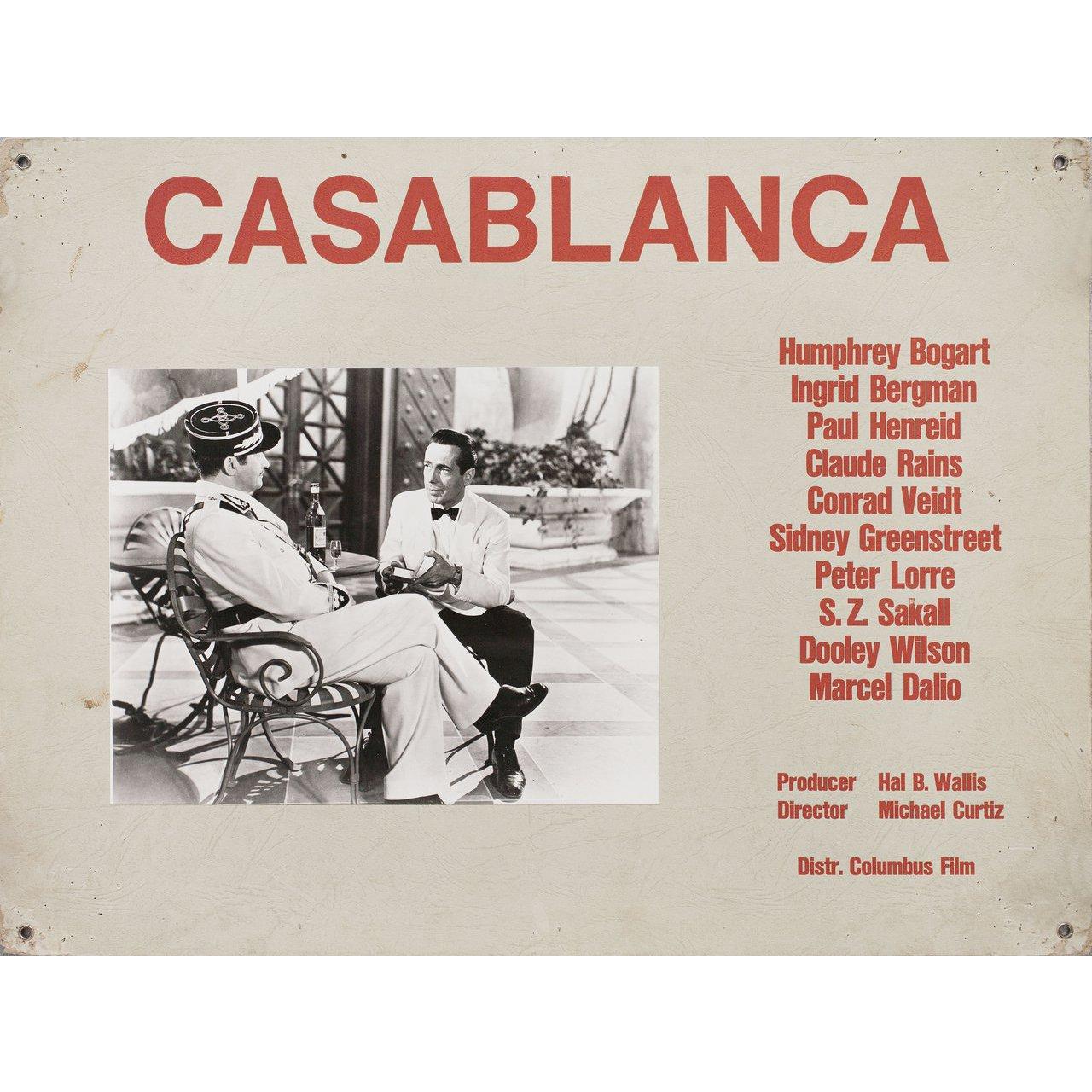 Original 1960s Swiss scene card for the 1942 film “Casablanca” directed by Michael Curtiz with Humphrey Bogart / Ingrid Bergman / Paul Henreid / Claude Rains. Very good-fine condition, pinholes. Please note: The size is stated in inches and the
