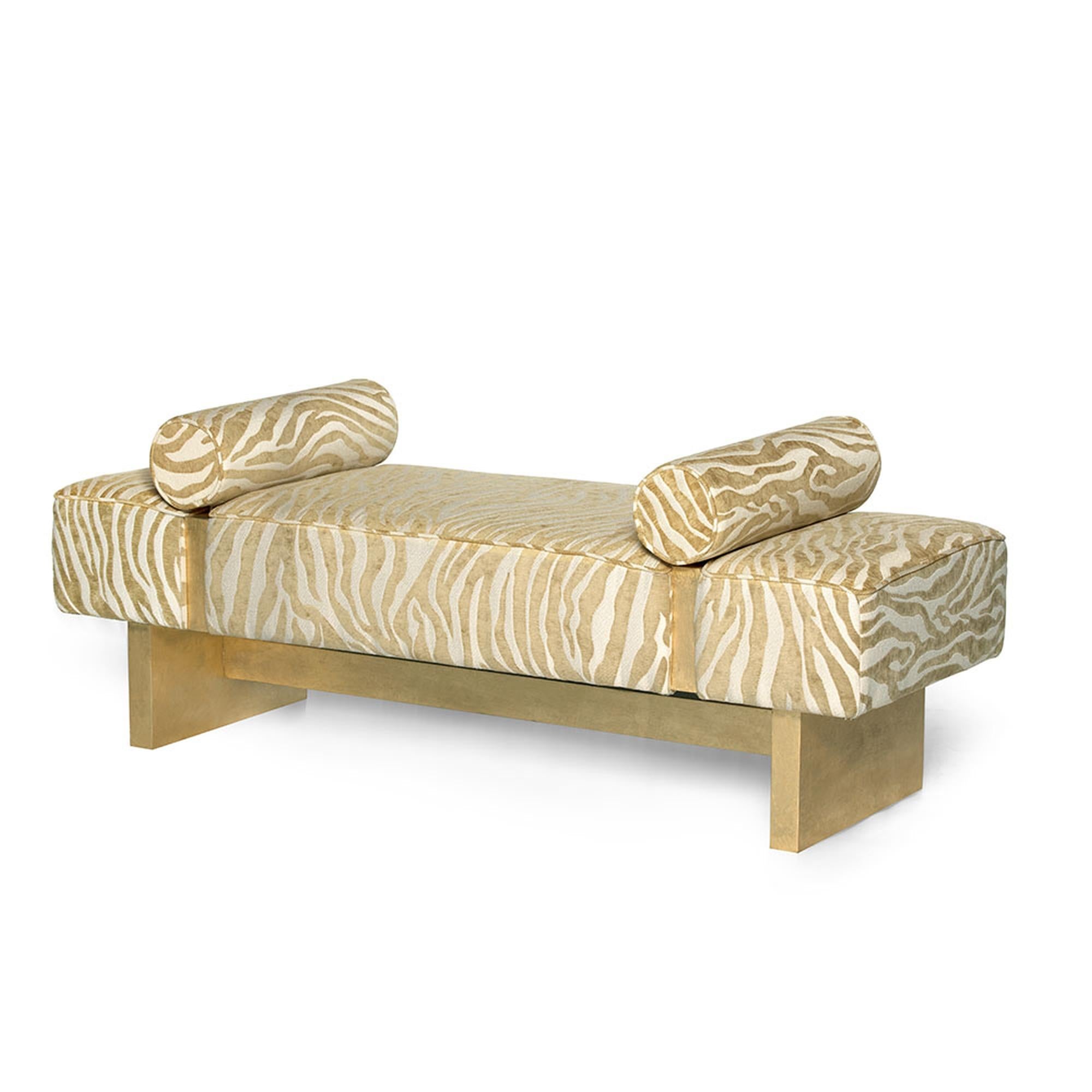 The Casablanca bed bench has a unique and sophisticated design that delivers utmost elegance and charm. With the combination of its hand-gilded wooden base and upholstered body and pillows, the bench is designed to capture attention. Due to the