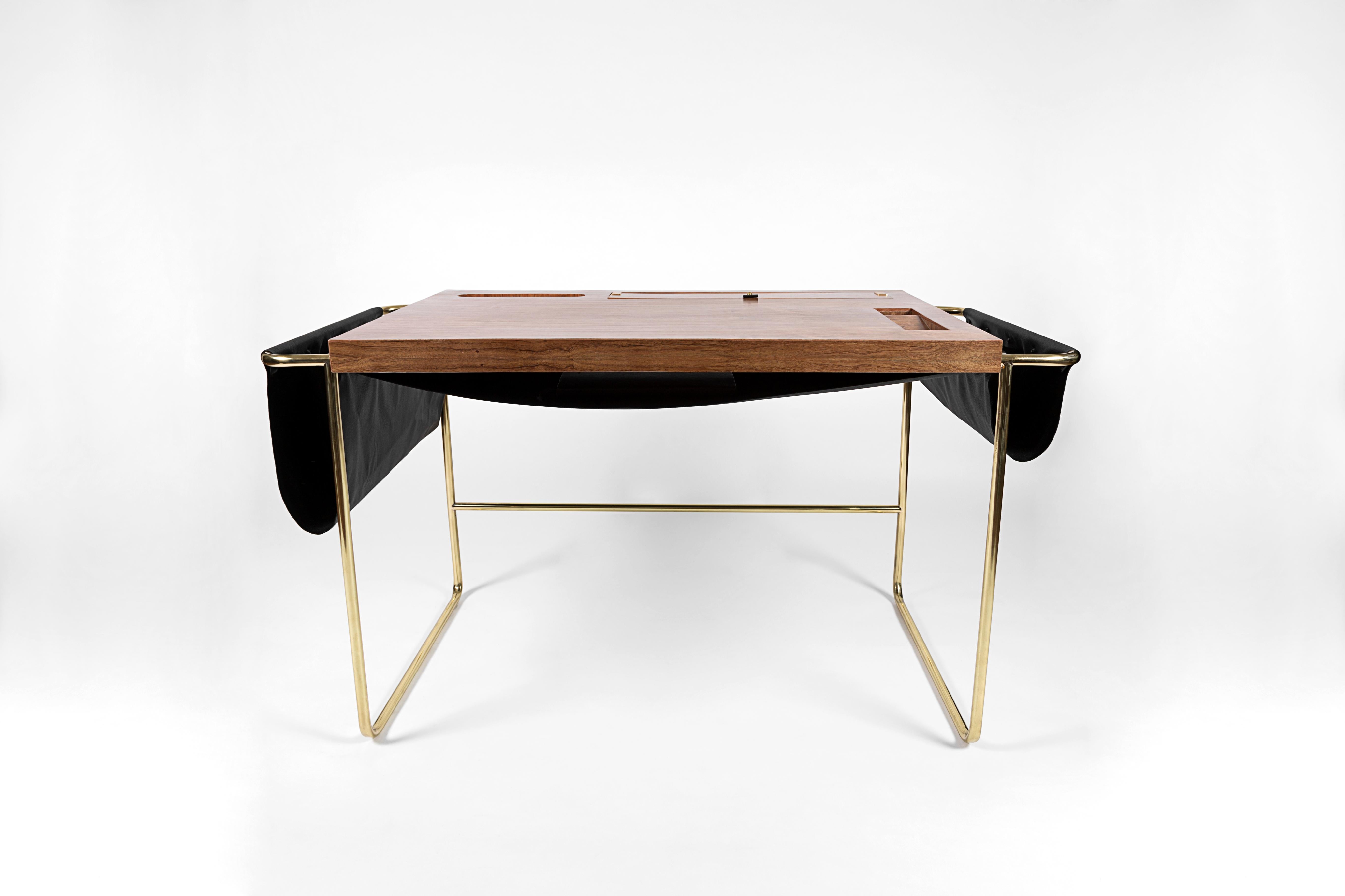 Casablanca desk by Nomade Atelier
Dimensions: D 130 x W 60 x H 73 cm
Material: Brass, walnut, leather.
Available in black leather. For others finishes,

A striking balance between sharp edges and soft leather pocketing is found in the