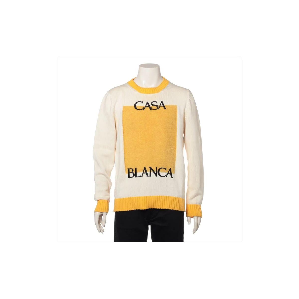 The Casablanca Logo Cotton Knit Sweater in Ivory and Yellow is a stylish blend of comfort and contemporary flair. Crafted from soft, breathable cotton knit, the sweater features a relaxed silhouette perfect for year-round wear. The ivory base is