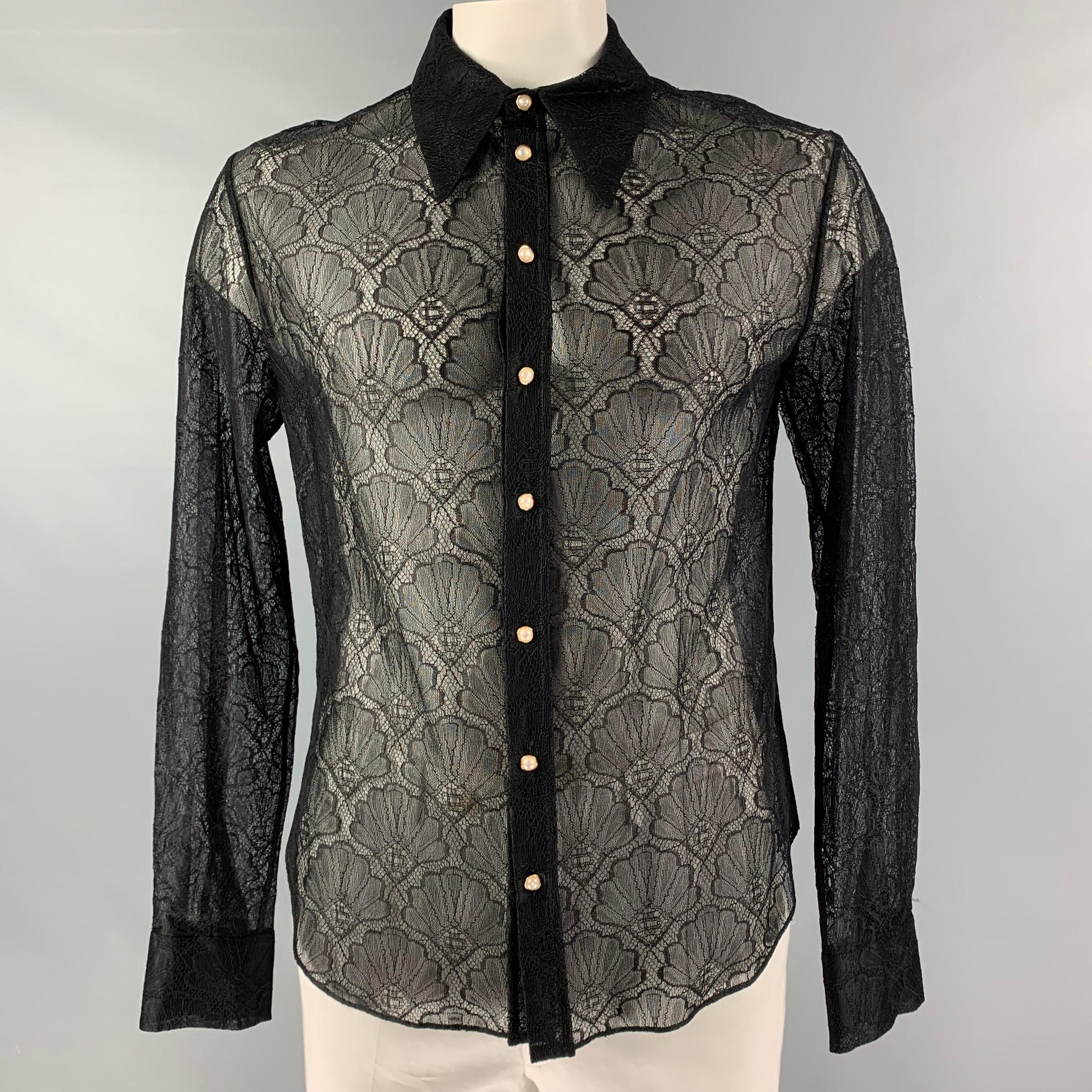 CASABLANCA long sleeves shirt comes in black lace polyamide blend material featuring a cutaway collar, faux pearl buttons, and button down closure. Made in Italy.

New with Tags 
Marked: XL

Measurements:

Shoulder: 20 in.
Bust: 45 in.
Sleeve: 27.5