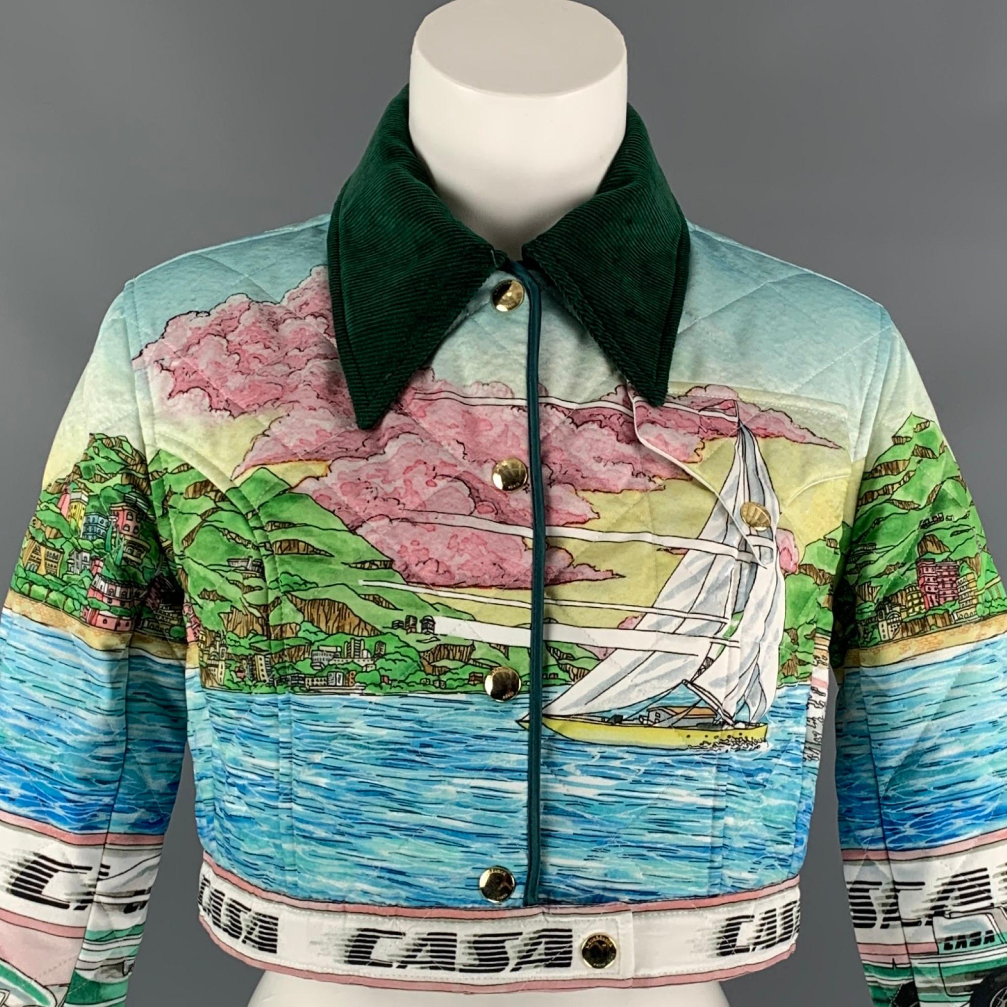 CASABLANCA jacket comes in a multi-color printed quilted satin with a full liner featuring race-ready graphics, gold popper fastenings, and a emerald green corduroy pointed collar and cuffs. Made in Italy.

Excellent Pre-Owned Condition.
Marked: