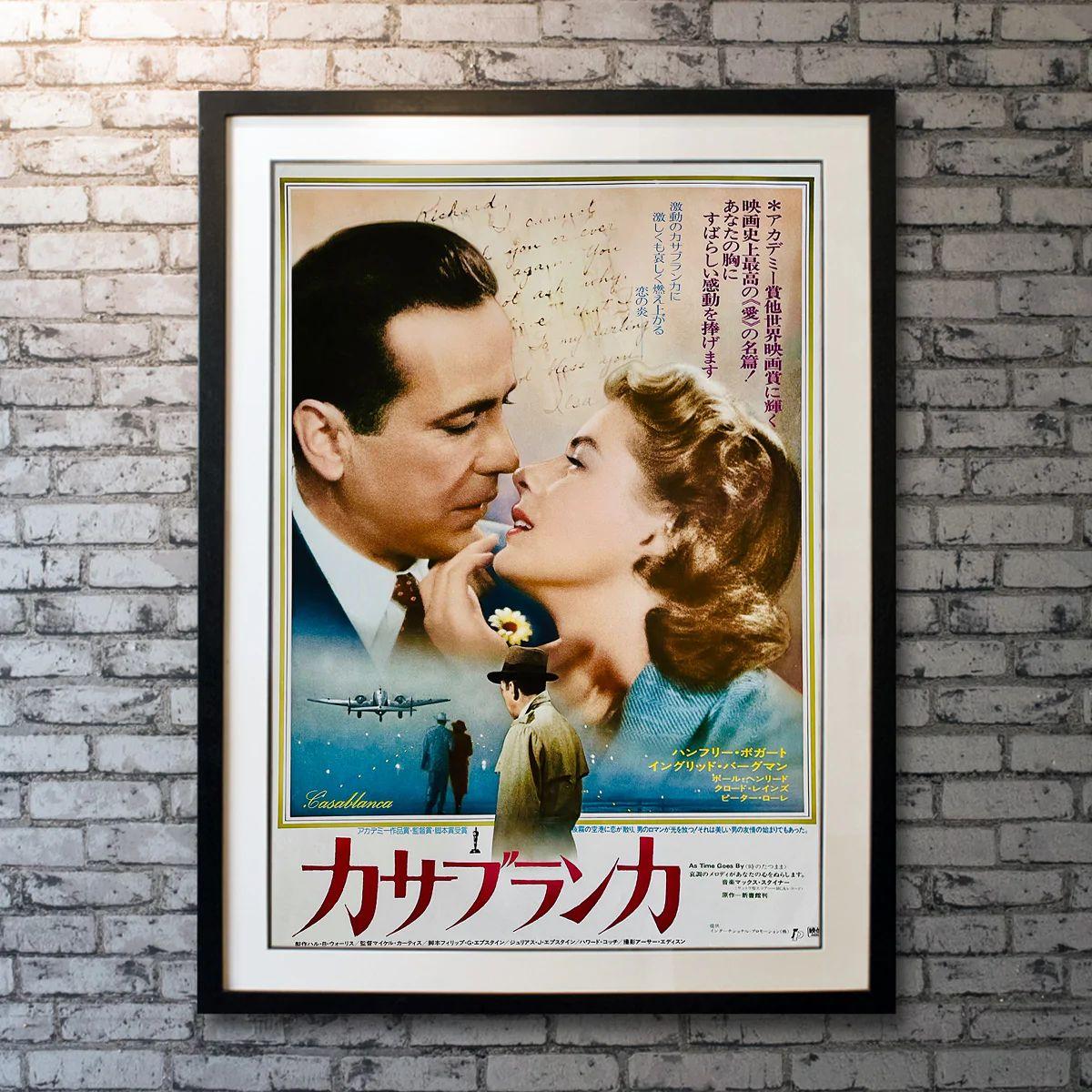 Casablanca, Unframed Poster with Linen Backing, 1974

Japanese B2 (20 x 29). This 1974 re-release Japanese poster features artwork not found on any other poster for this classic picture. Humphrey Bogart and Ingrid Bergman are shown against the