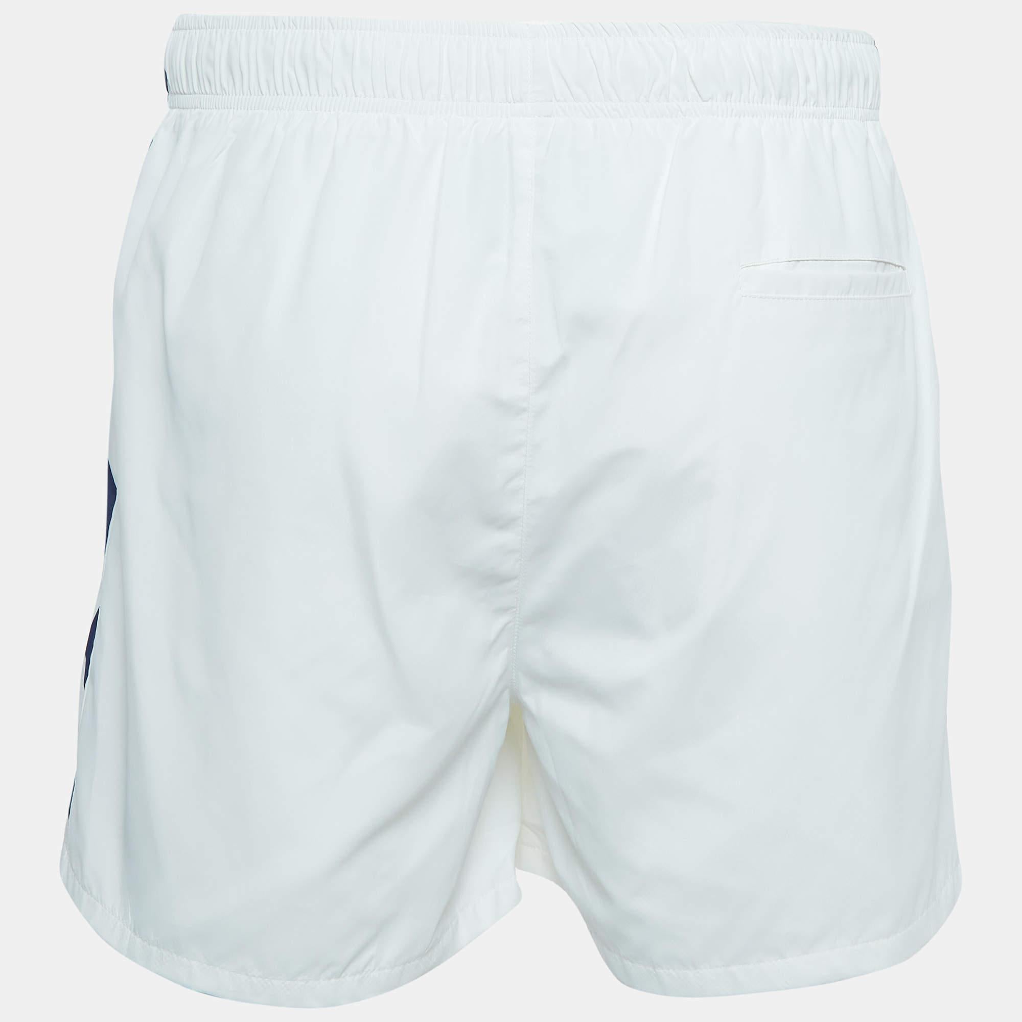 The Casablanca shorts offer a stylish and comfortable workout essential. Crafted from high-quality synthetic fabric, these shorts feature a crisp white hue with subtle prints, ensuring a trendy look. The design seamlessly blends fashion and