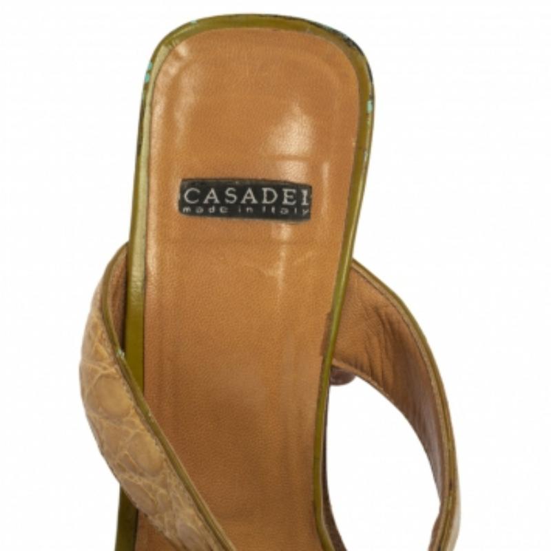 Comfort, luxury, and high-fashion come combined in these slides from Casadei! They are designed with dual straps and balanced on 9 cm heels. The slides are made to lift you and your style by manifolds.
