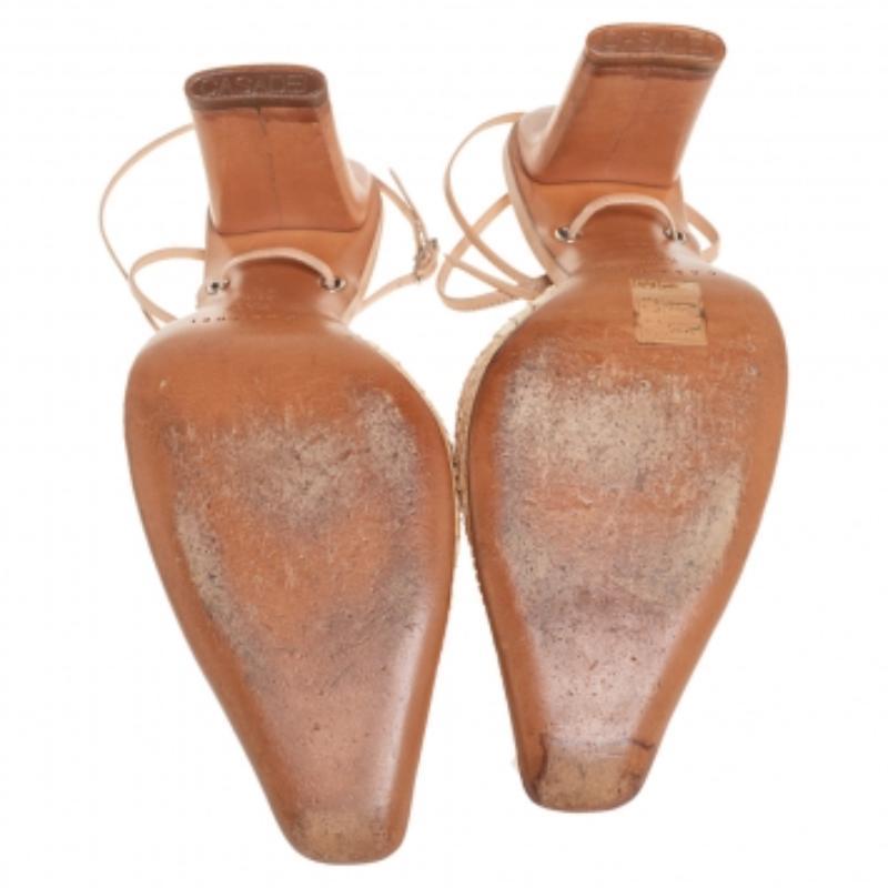 A seamless blend of style and comfort, the Casadei sandals a must-have. Crafted from snakeskin and leather, the pointed-toe silhouette is highlighted with a beige hue and ankle ties. The sandals are mounted on 10 cm heels. (NOTE: AVAILABLE FOR UAE