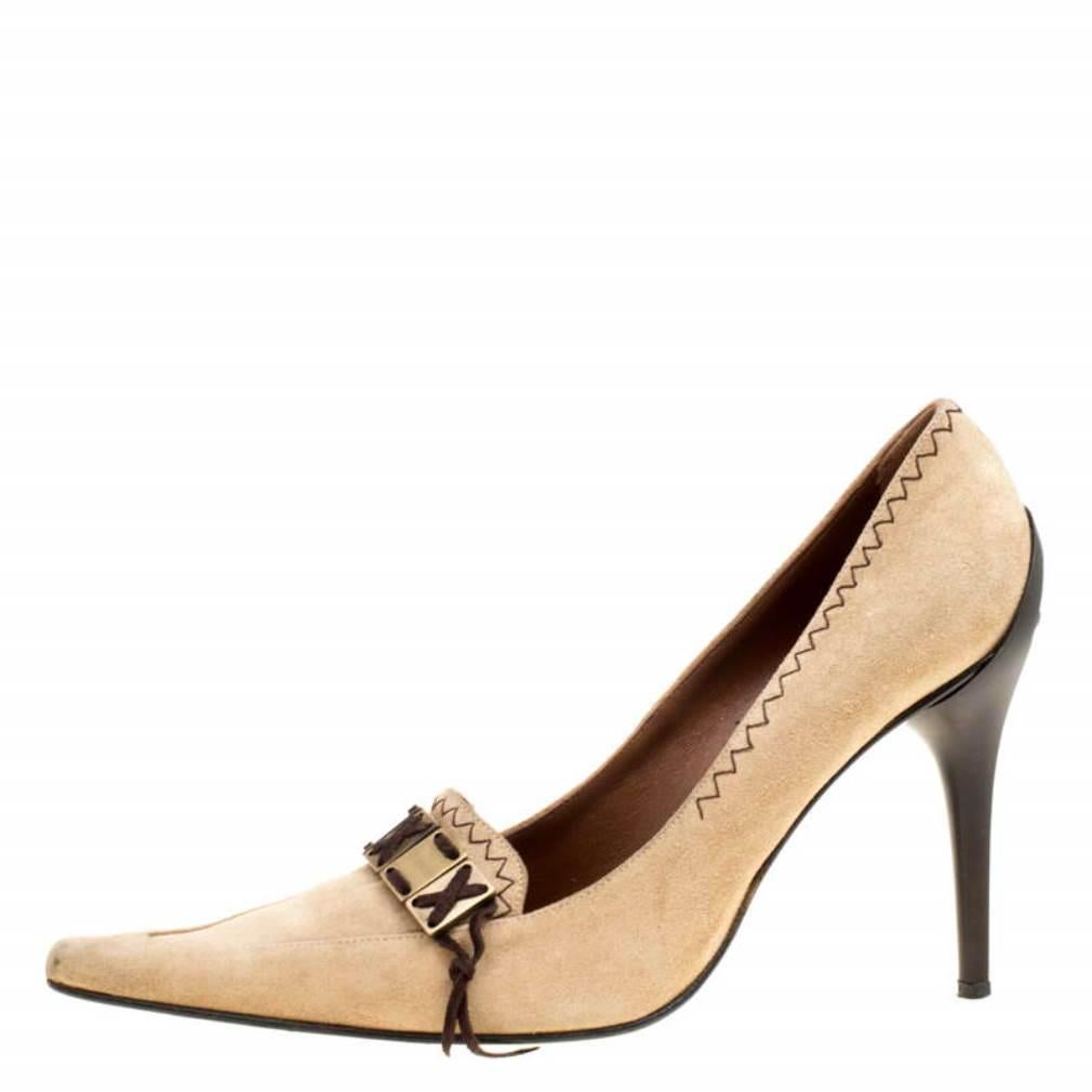 The contemporary pointed toes and muted beige suede exterior make these chic pumps from Casadei a fashion must-have. These pumps are easy to slip on if you are on your way to a fun evening out and are finished with an interesting stitch detailing on