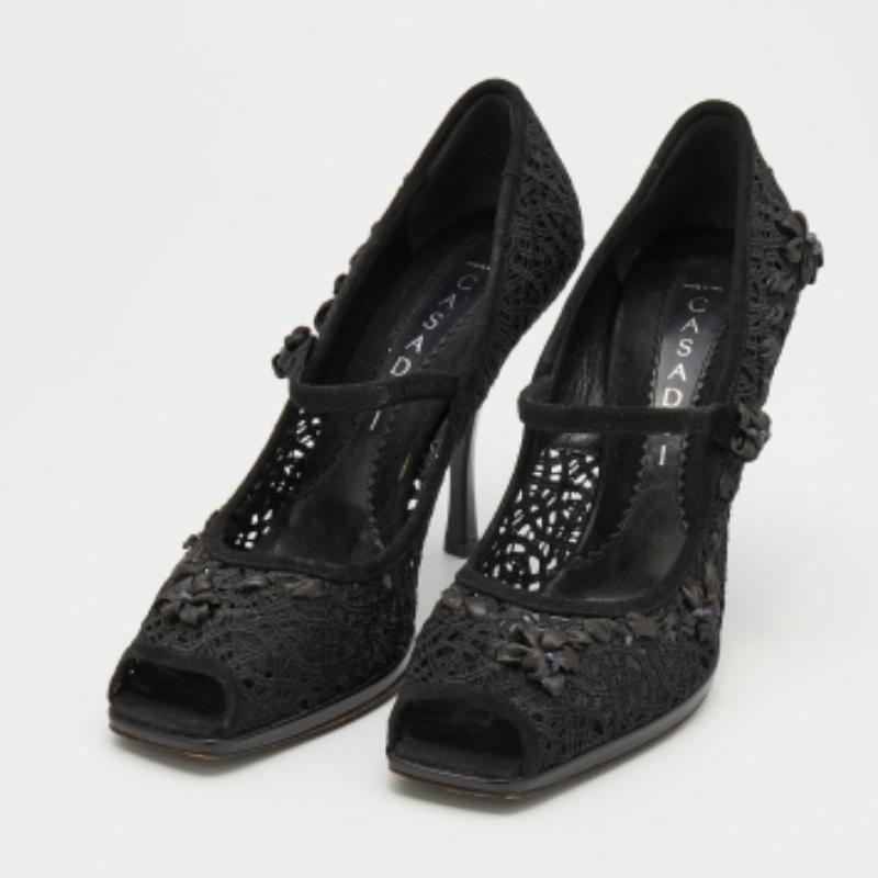 The intricate detailing makes this pair of Casadei pumps eye-catching. Created from nylon and suede, it flaunts a strap over the uppers, 10.5cm heels, and comfortable footbeds.
