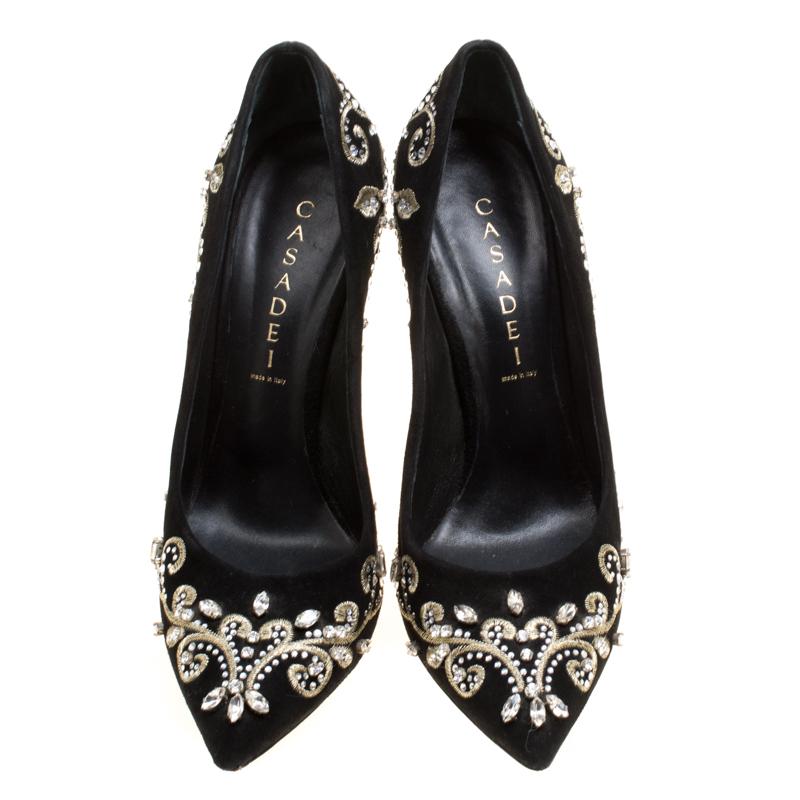 Exquisite and ethereal, these Casadei pumps are all you need to make heads turn and win never ending compliments! The black pumps have been crafted from suede and styled with pointed toes and crystal embellished floral embroidery on the exterior.