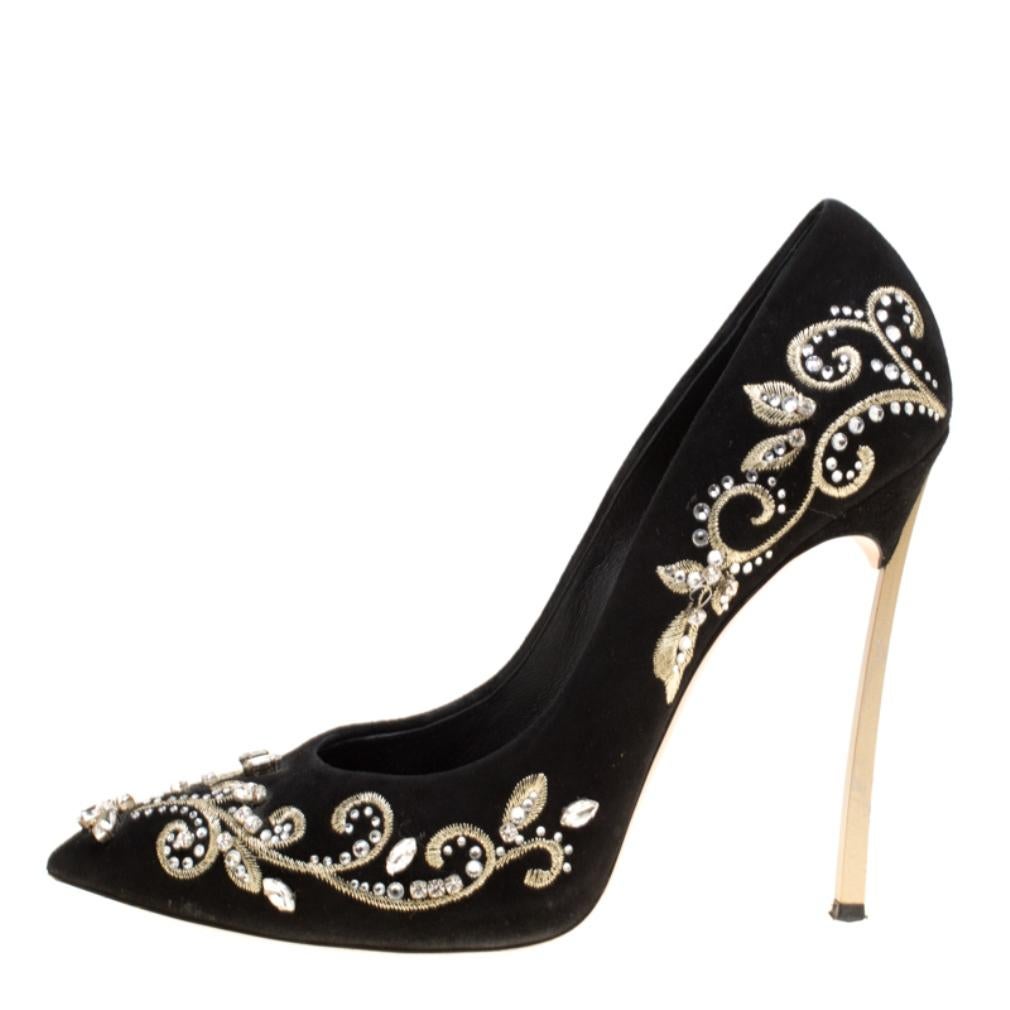 Exquisite and ethereal, these Casadei pumps are all you need to make heads turn and win never ending compliments! The black pumps have been crafted from suede and styled with pointed toes and crystal embellished floral embroidery on the exterior.