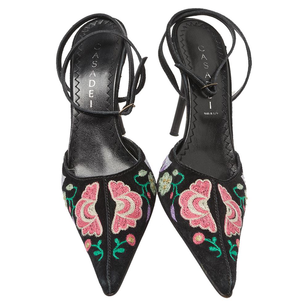 Gorgeous details and an understated elegance crowns these Casadei sandals. The black suede construction brings to life a pointed-toe silhouette that is enhanced by floral embroidered vamps and buckled ankle wraps. Set on 10.5 cm heels, these