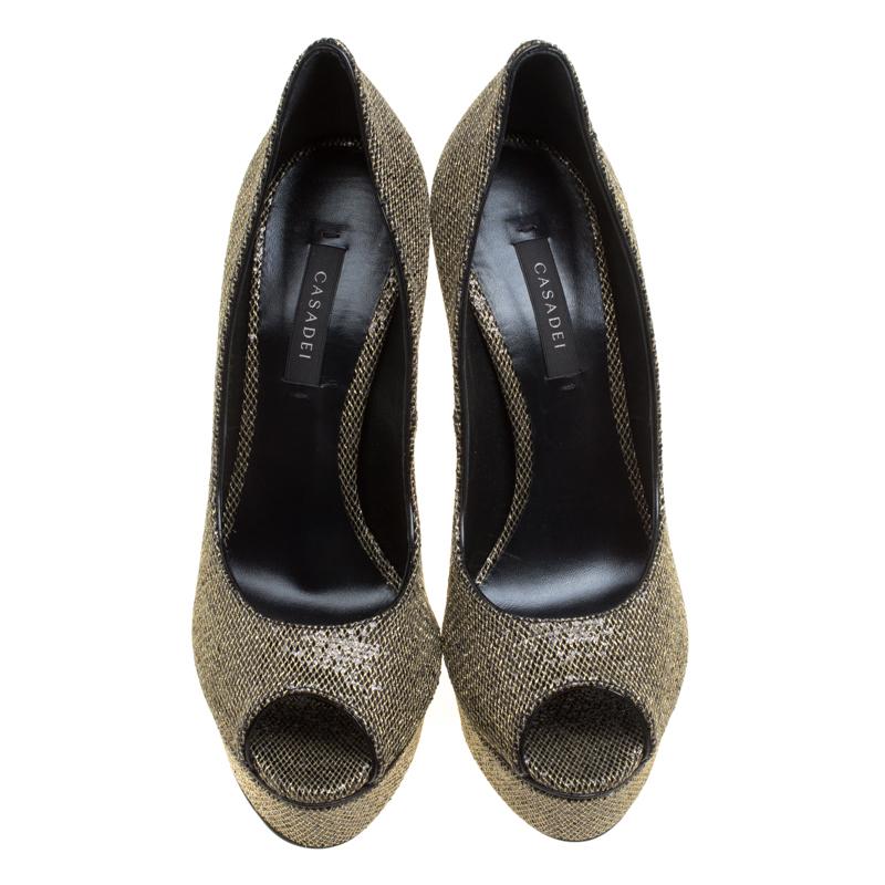Get set to dazzle the crowds with these shimmering Daisy peep-toe pumps from Casadei. The shining pair is crafted from black glitter lame fabric and looks ethereal with its fabulous craftsmanship. The pumps flaunt leather lined insoles, solid