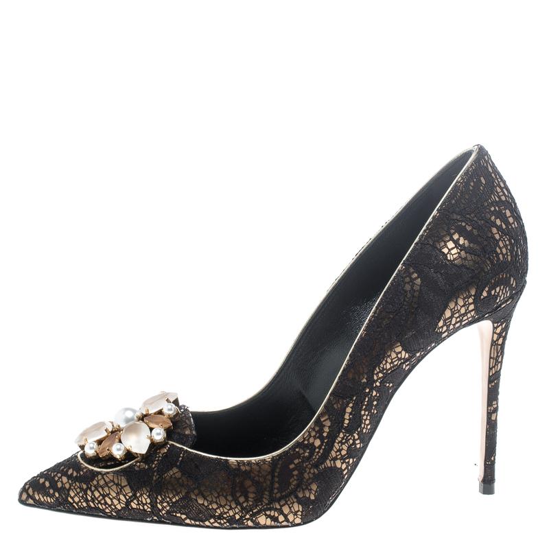 There's nothing that speaks elegance better than lace and that's why these pumps by Casadei are a dream worth owning. Beautifully designed with lace, these pumps flaunt crystal embellishments, pointed toes and 10.5 cm heels. Strike the right pose by