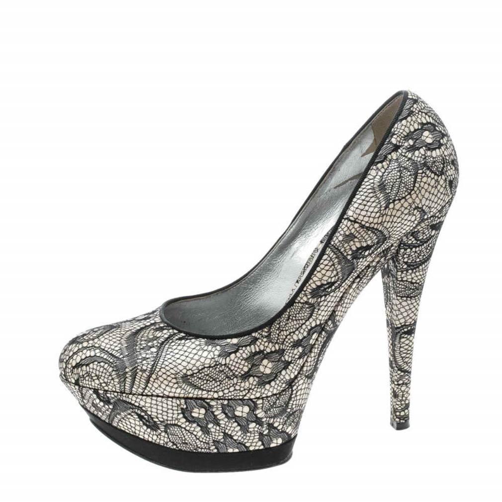There's nothing that speaks elegance better than lace and that's why these pumps by Casadei are a dream worth owning. Beautifully designed with fabric and lace, these pumps flaunt platforms, 14 cm heels, and comfortable leather insoles. Strike the
