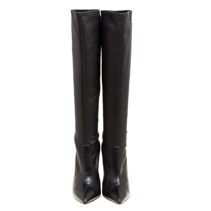 It's time to rock all your outings with these chic and smart knee length boots from Casadei that exude oodles of style. These black boots are crafted from leather and flaunt pointed toes. They come equipped with comfortable insolea and the signture