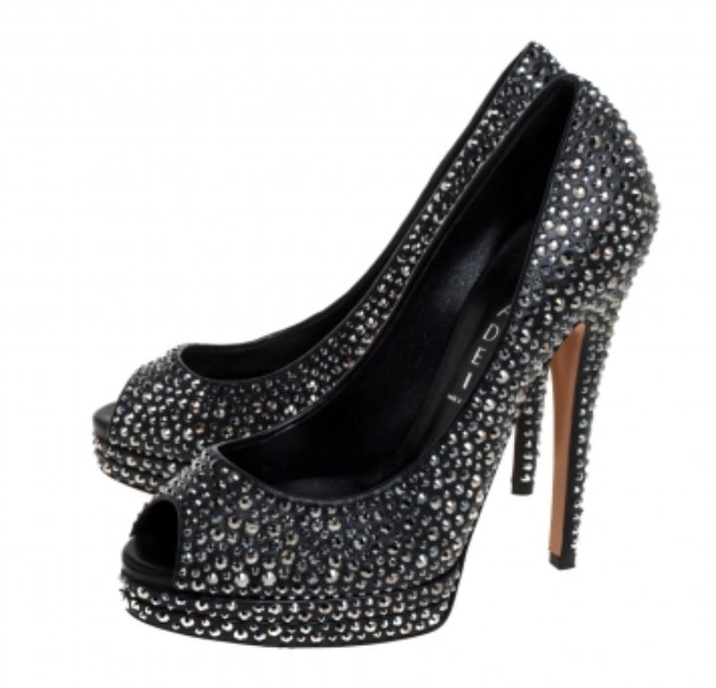 Finesse and poise will all come naturally to you when you step out in this pair of pumps from Casadei. Beautifully embellished with Swarovski crystals, the peep toe pumps are truly breathtaking. They are complete with leather insoles, 14 cm heels,