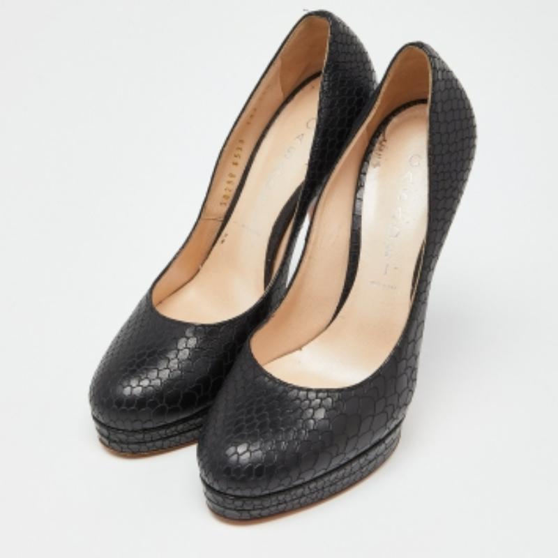 Make the streets your fashion runway with these spectacular pumps from Casadei. Chic in black, these pumps are crafted from python-embossed leather exterior. They flaunt solid platforms, sculpted high heels and comfortable leather-lined insoles.