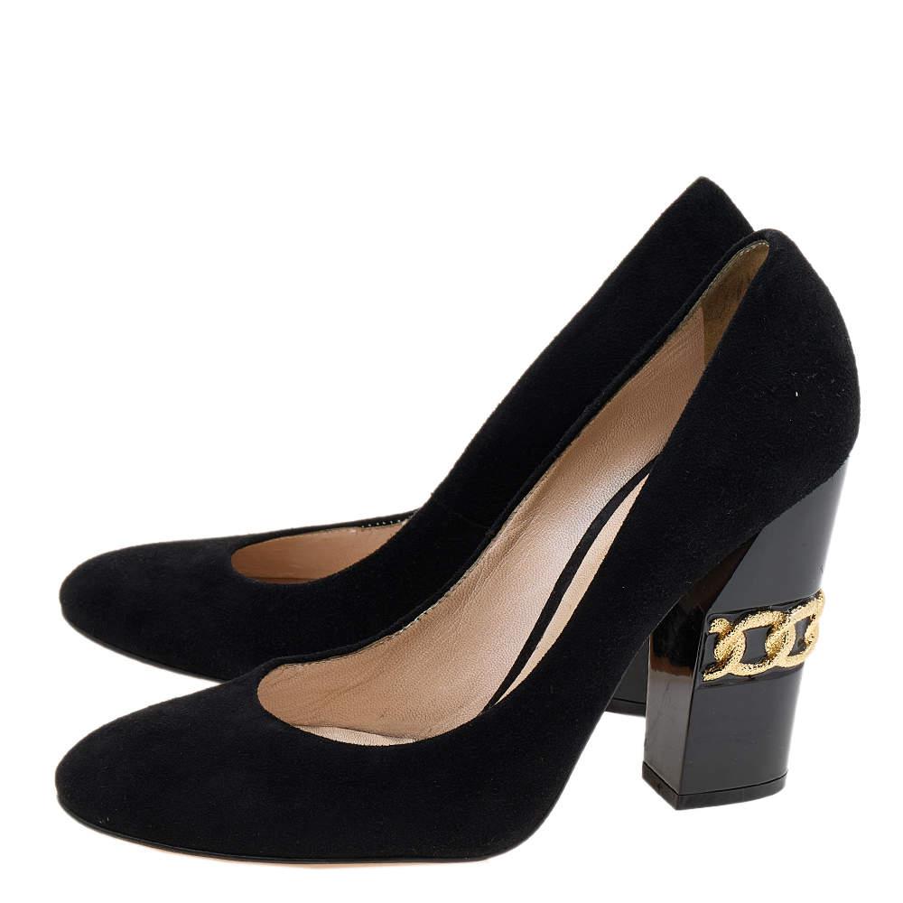 These Casadei pumps are a great choice if you’re looking to add a pair that's both classy and bold. The pair has been made in Italy from black suede and set on chain-embellished block heels.

