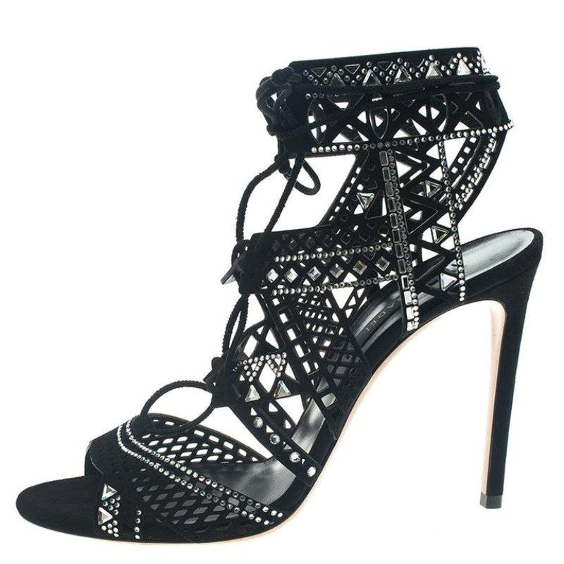How can one not fall in love with these sandals by Casadei! They've been beautifully crafted from black suede and lined with pretty crystals on the strappy layout. The sandals carry leather insoles, ankle ties, and 10.5 cm heels.

Includes: Original
