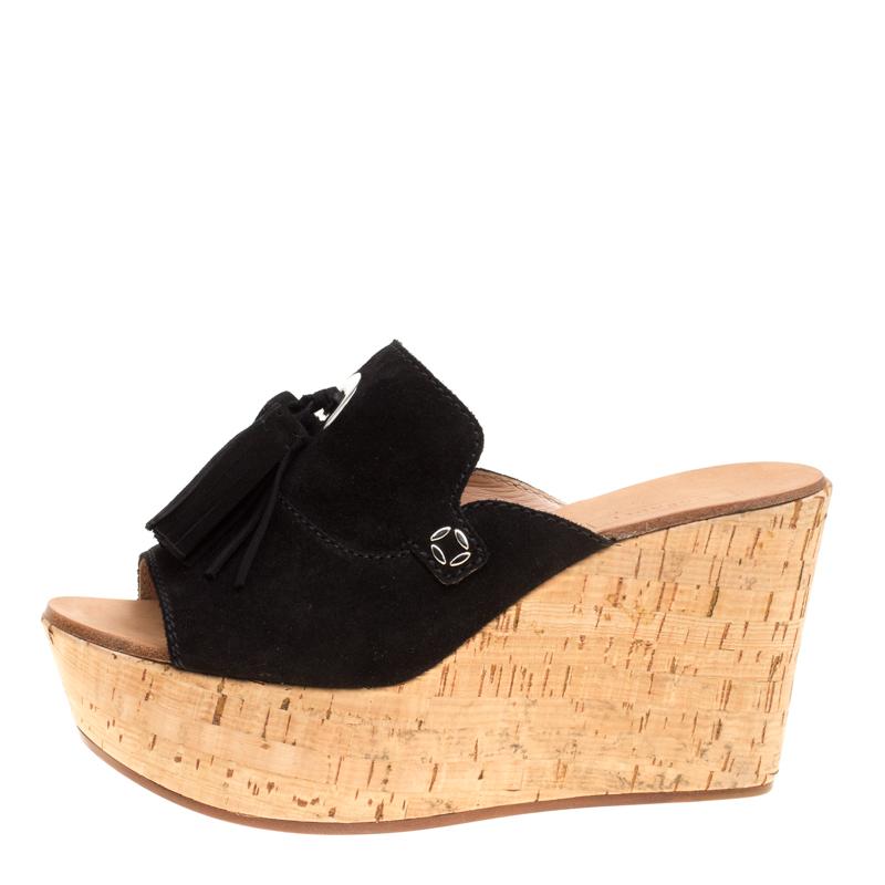 These pretty slides by Casadei will be a perfect host for the spring and summer looks. Crafted in suede, they feature open toes and a front strap detailed with matching tassels along with leather lined insoles. This pair is elevated on 10cm