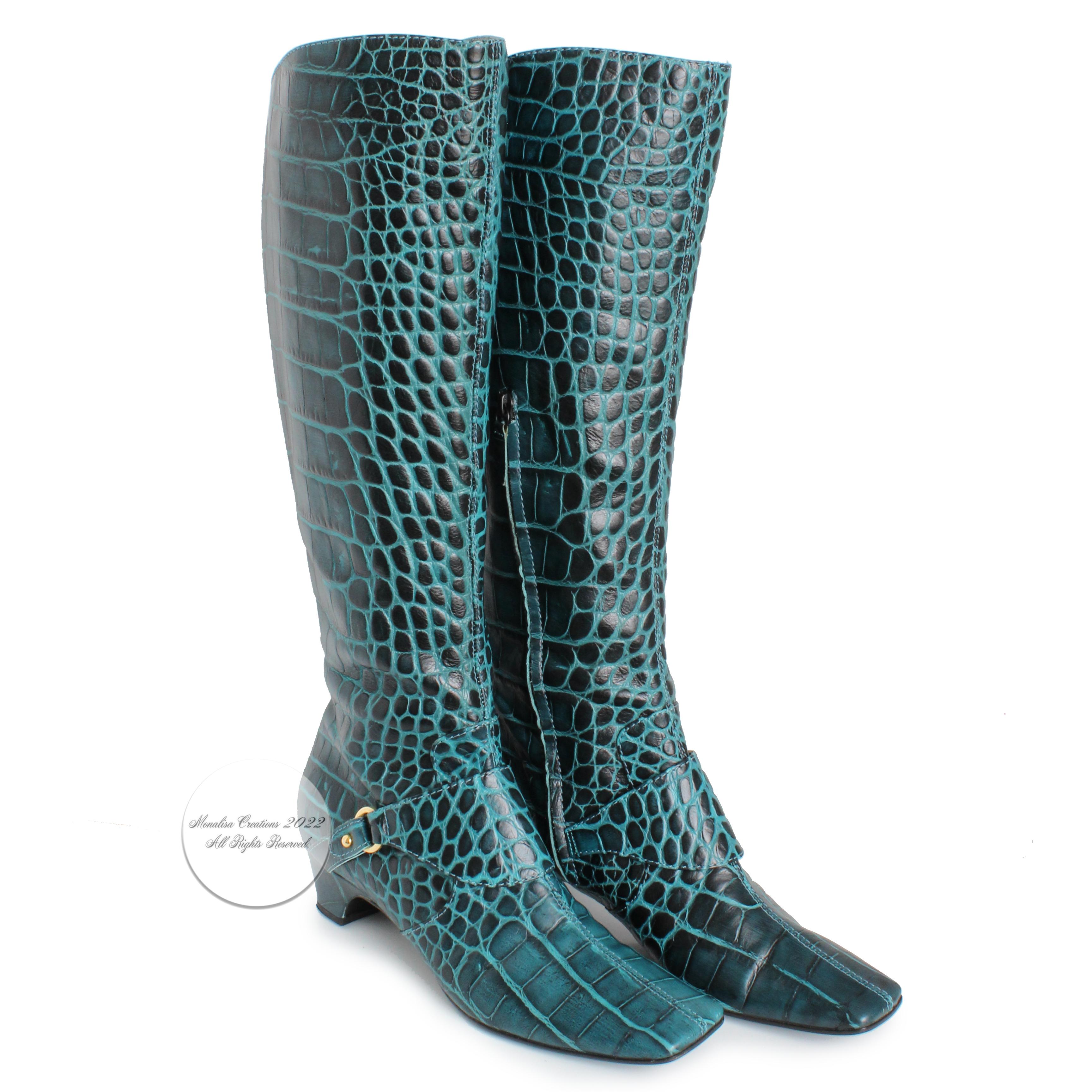 Fabulous croc-embossed leather boots by Casadei, made in Italy most likely in the 90s.  Made from a green/blue croc-embossed leather, they feature a gold ring with strap across the ankle, inner calf partial zippers and block heels.  Incredibly chic