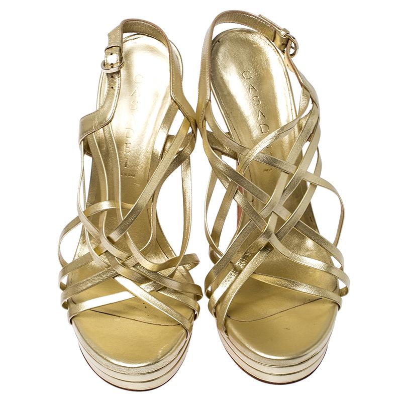 Casadei is a brand that is known for exquisite craftsmanship, especially when it comes to a pair of gorgeous sandals like these. This strappy pair is crafted with exquisite gold leather. They are designed for a night out and come with a small