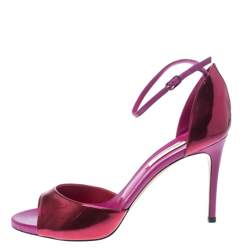Raising the temperatures and making the hearts flutter are these stunning Candylux sandals from Casadei. These metallic pink sandals are crafted from leather and feature a peep-toe silhouette. They flaunt single vamp straps and buckled ankle straps.