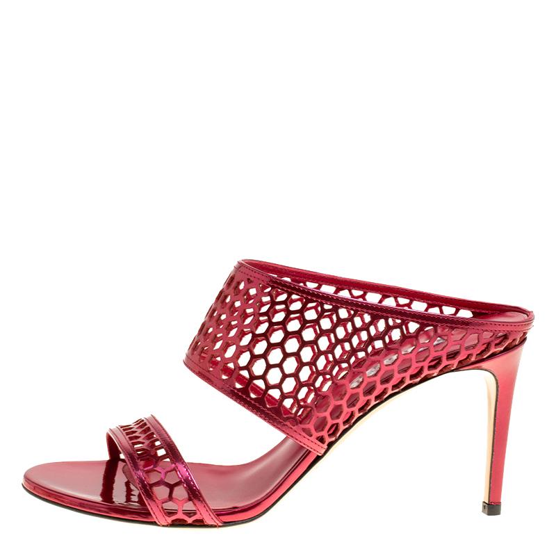 Add a feminine touch to your evening look with these sandals from Casadei. Rendered in red metallic leather, the pair features a beautiful exterior designed with straps that are accented with geometric cutout details. These sandals are elevated by 9