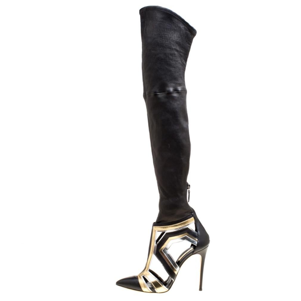 We are swooning over this pair of boots from Casadei as they are well-made and utterly gorgeous! They are crafted from leather as over-the-knee and designed with pointed toes, metallic leather trims, and cutouts. The boots are complete with back