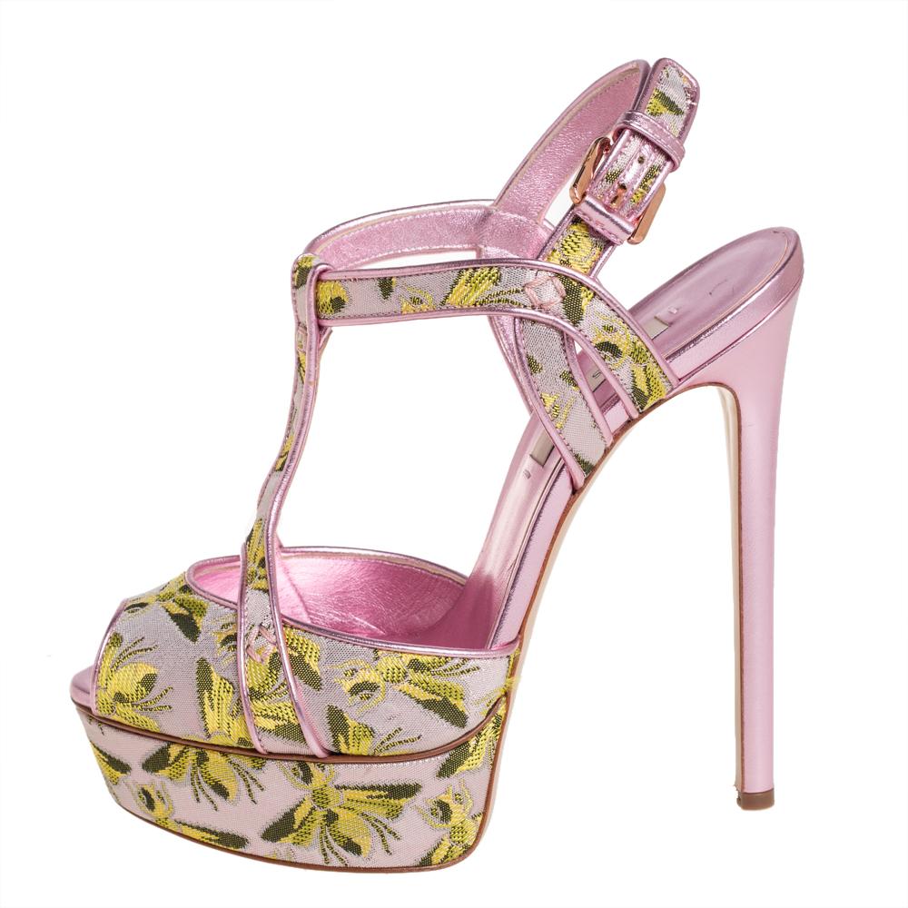 Casadei sandals that are fun and gorgeous! Crafted in jacquard fabric featuring bee motifs and pink leather, the sandals are secured with buckle ankle straps and elevated on platforms and 14.5 cm high heels.

Includes: Original Dustbag, Original